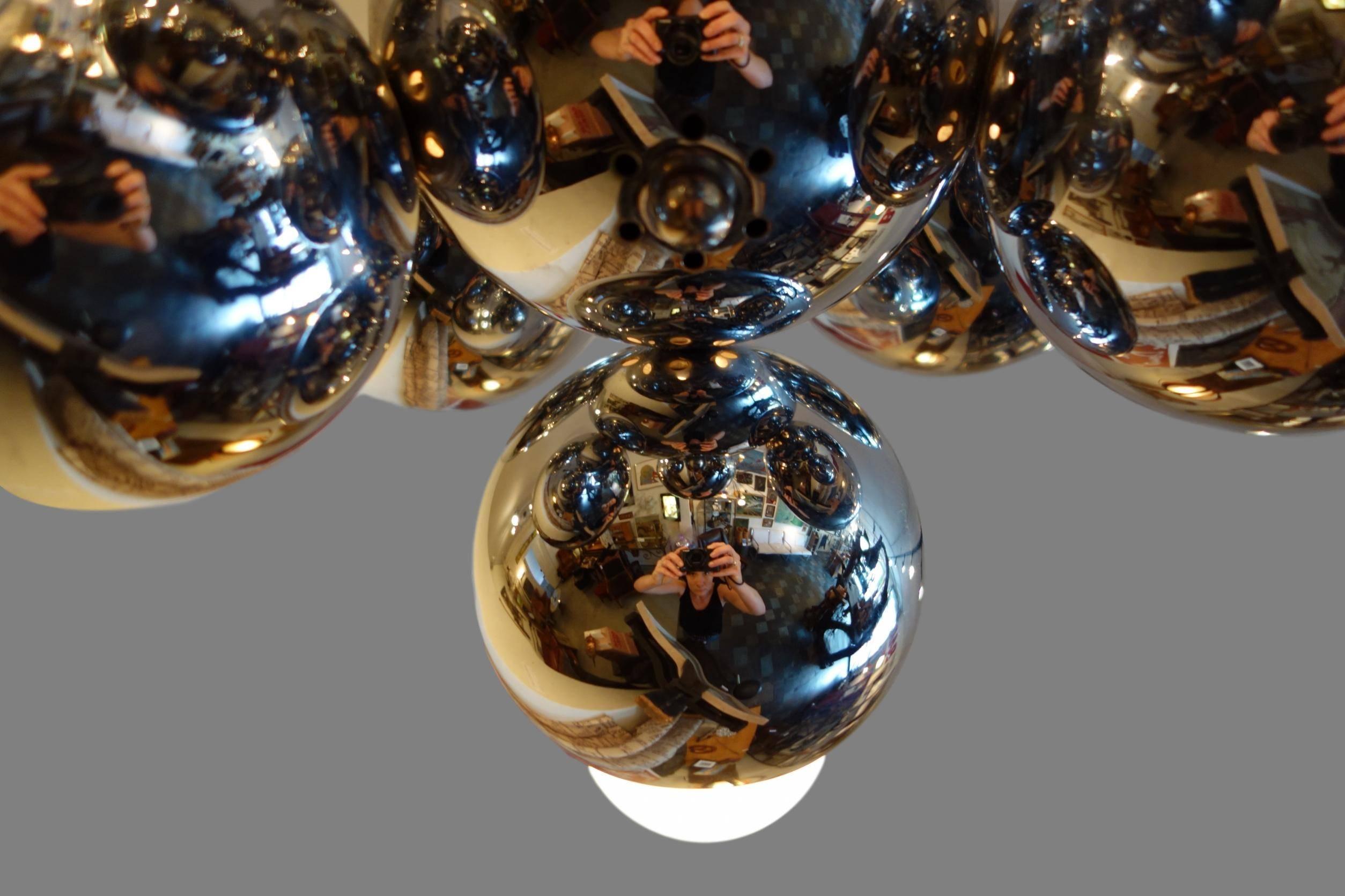 This is a midcentury eight light atomic chrome Sputnik chandelier. Measure: Drop height is 27.5