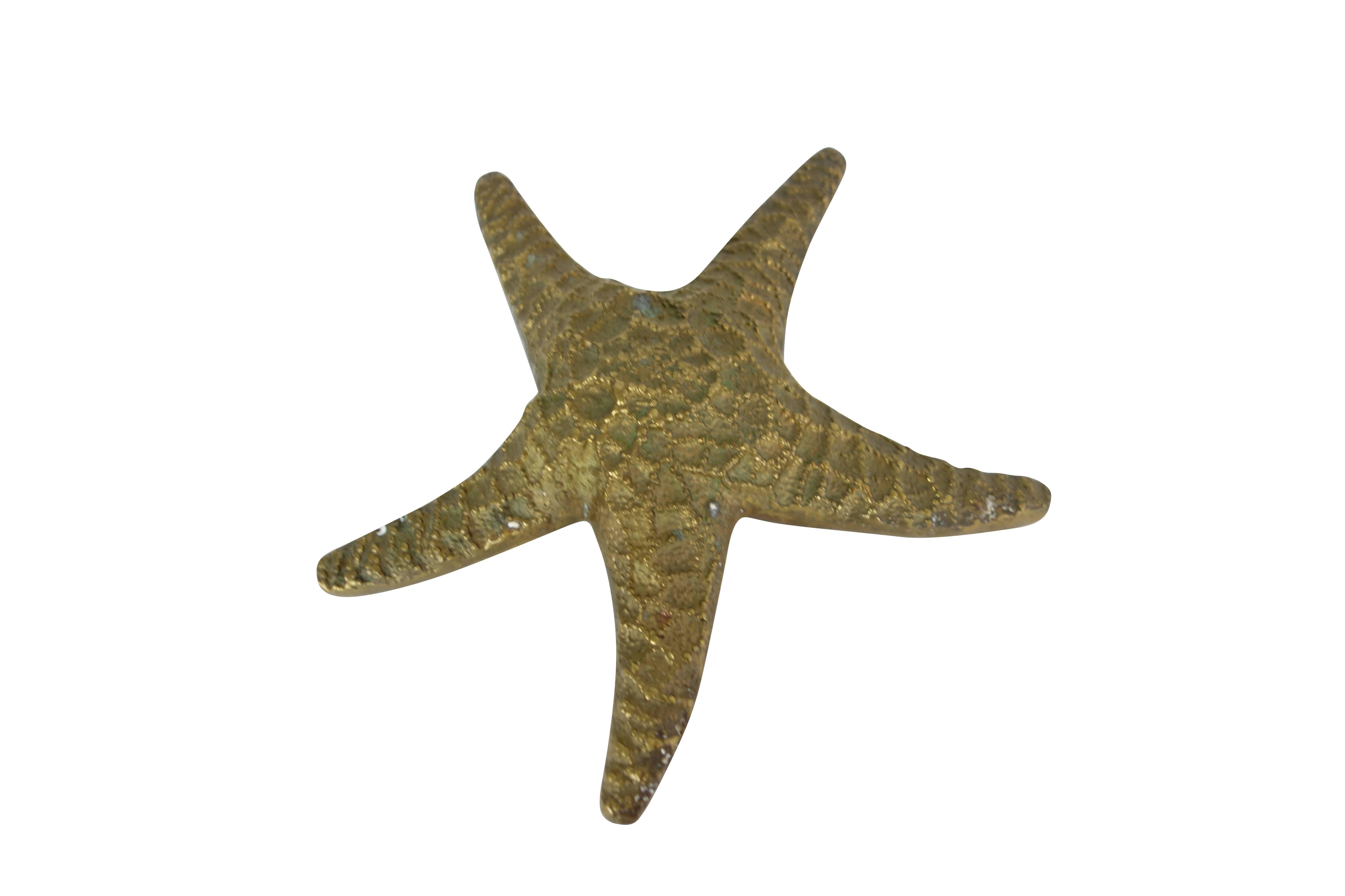 This is a vintage cast brass starfish.