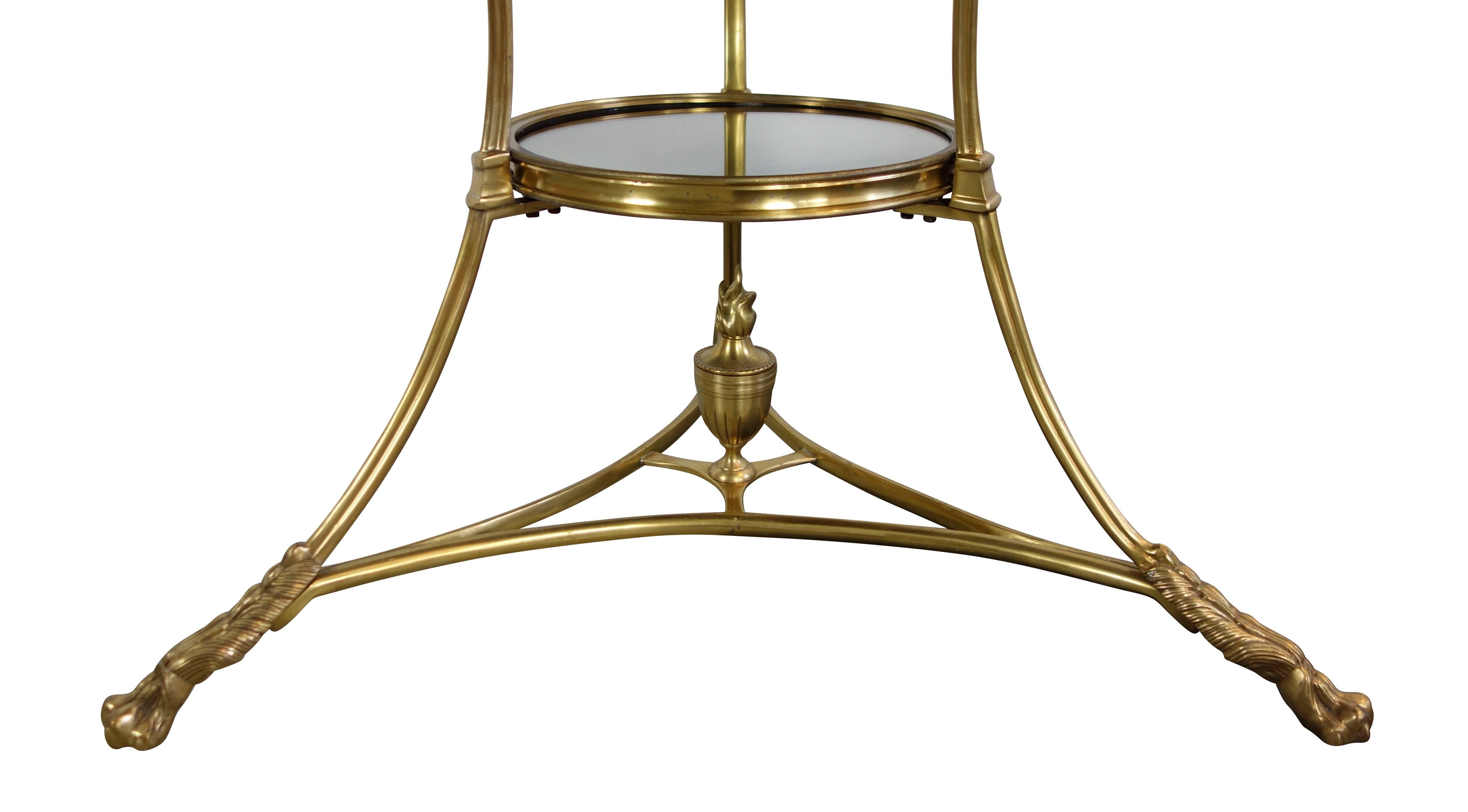 This is a smoke mirrored glass and brass bistro table from Bruges, Belgium with claw feet and flaming chalice detail, circa 1970. There are a total of two available and look beautiful flanking a sofa.
Table measure is 27