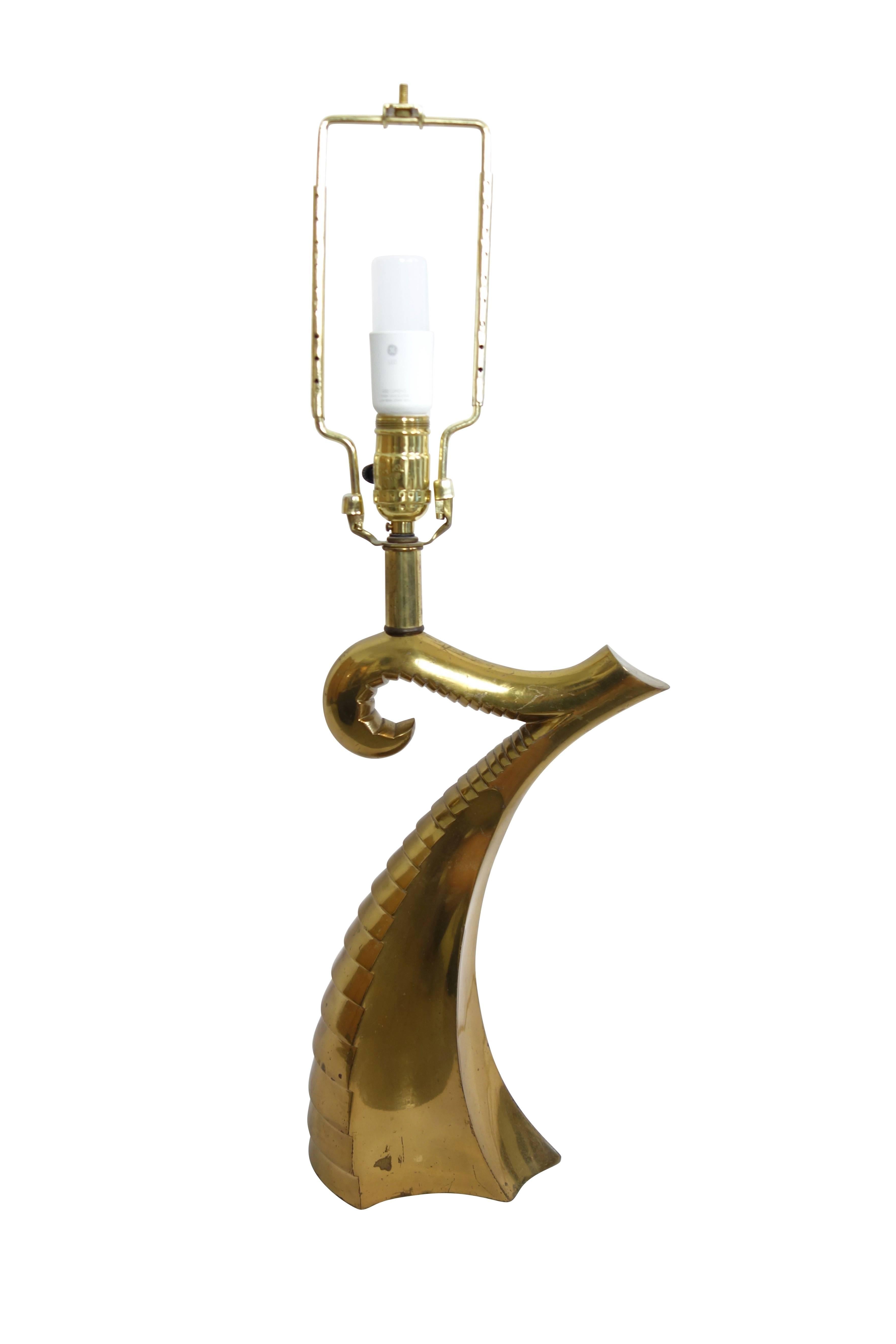 This is a sculptural brass table lamp in the form of a large tentacle, circa 1970.