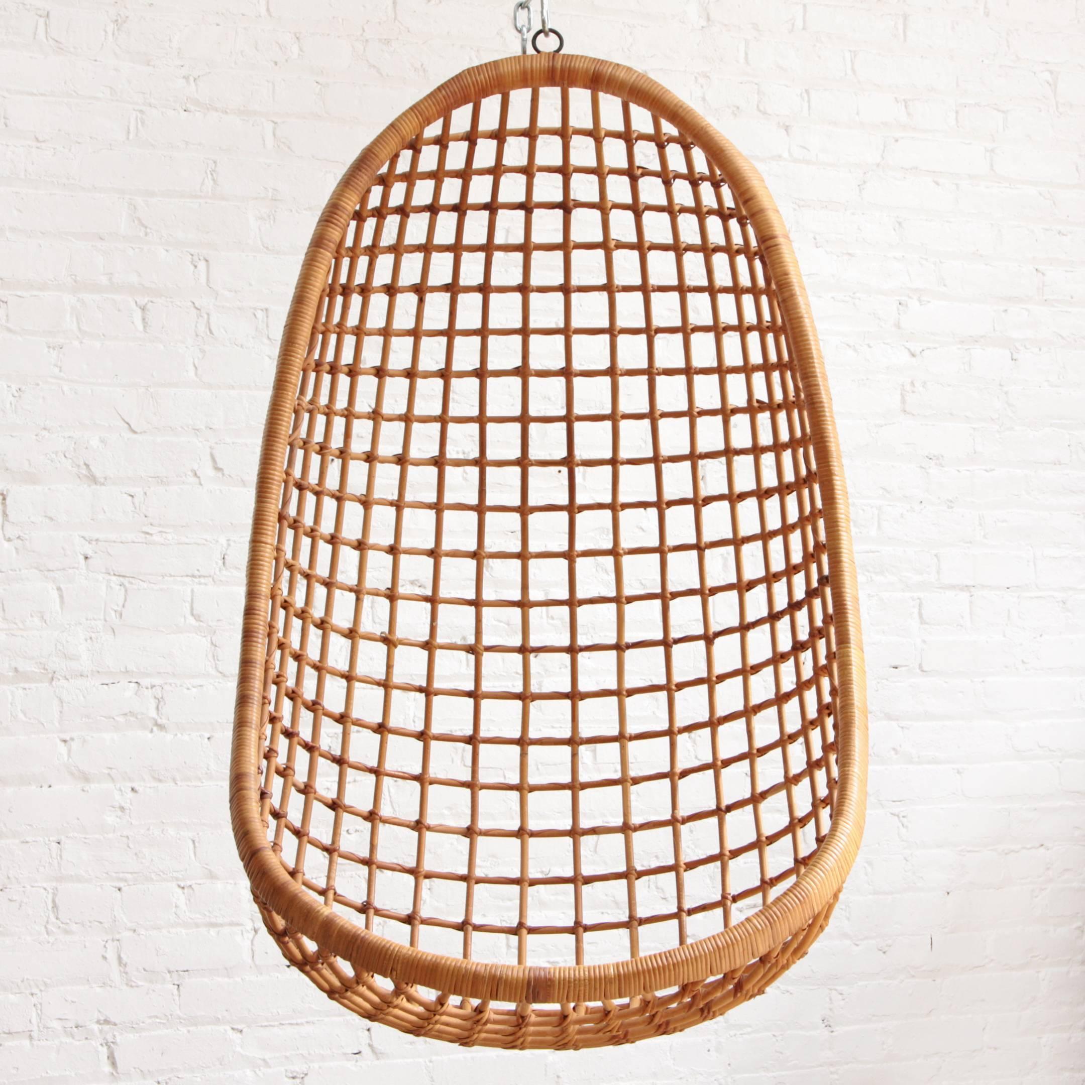 Bent bamboo and cane hanging egg chair by Rohe Noordwolde, The Netherlands, 1960. Reinforced with iron cage and hanging point.

Measurements refer to size of actual object. Seat height is dependent on how high chair is hung.