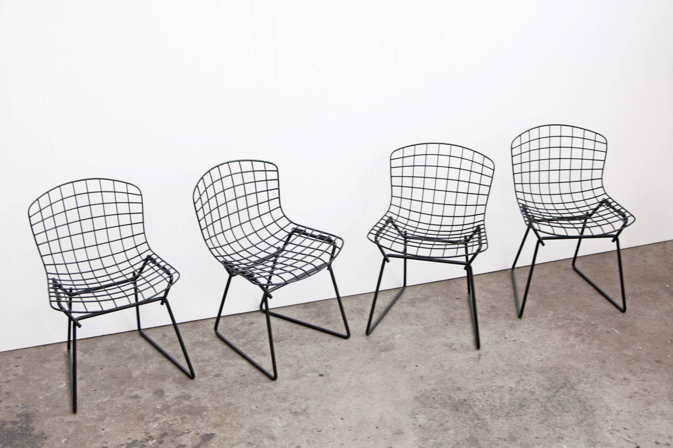 Wire chairs designed by Harry Bertoia for Knoll. Original 1960s children's or mini size. 

This listing is for all four chairs. We have a pair of white ones available, inquire if you are interested in two.