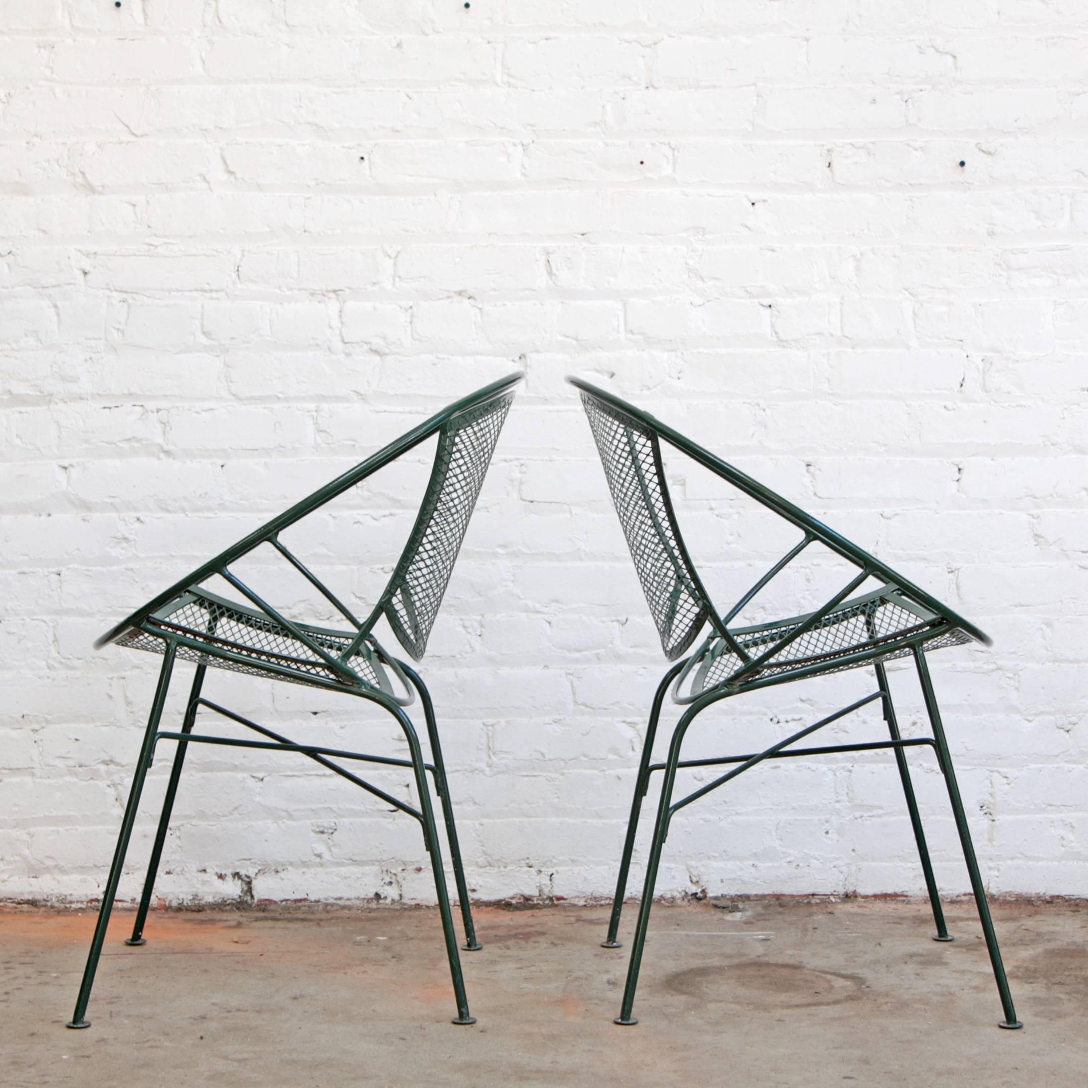 The radar chair or clamshell chair by Maurizio Tempestini for John Salterini. Minimalist design, wrought iron construction. These chairs were initially designed as outdoor / patio furniture but are comfortable and commonly used indoors as well.