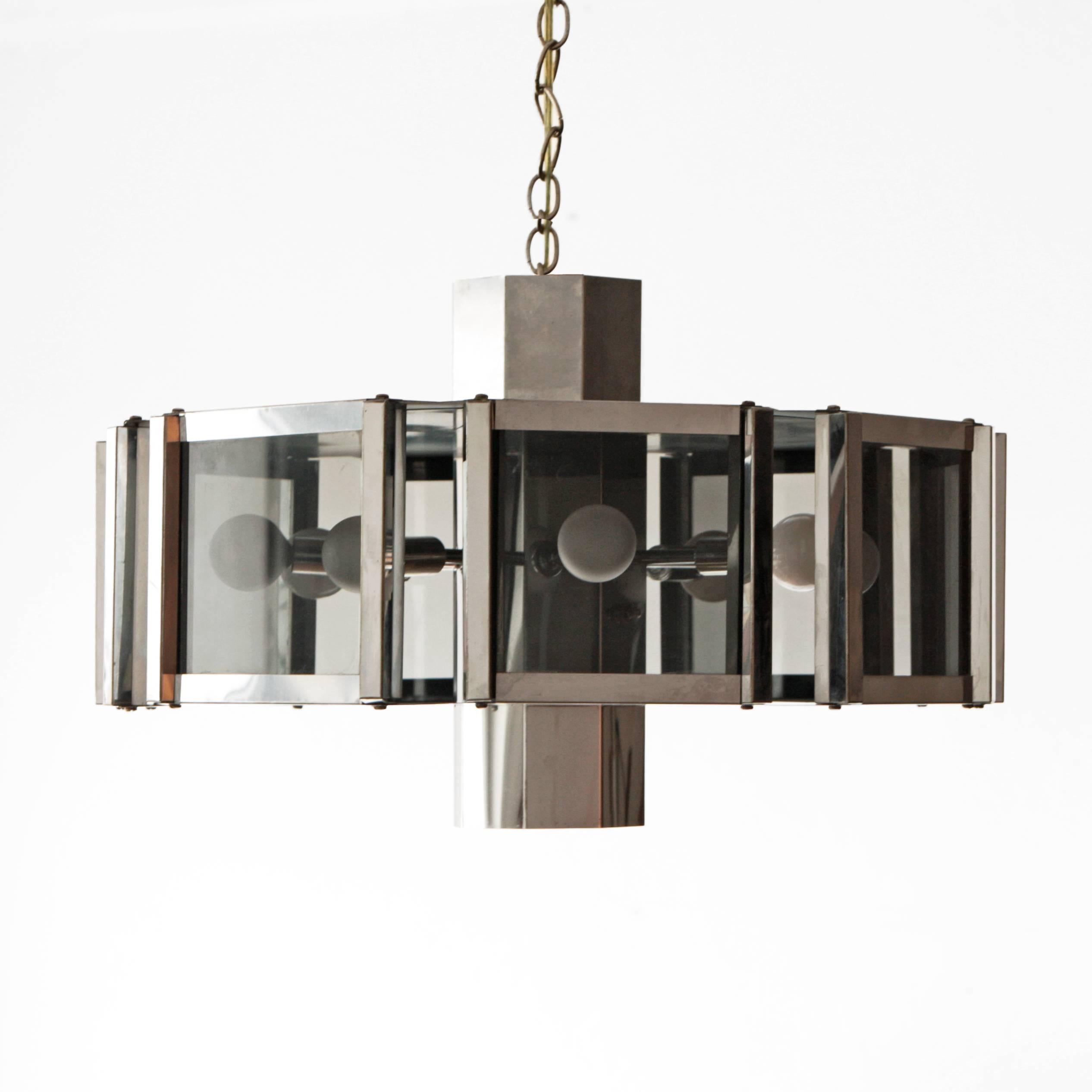 Chandelier designed by Robert Sonneman. Chrome with smoked glass panels takes nine lightbulbs and looks great on a dimmer.