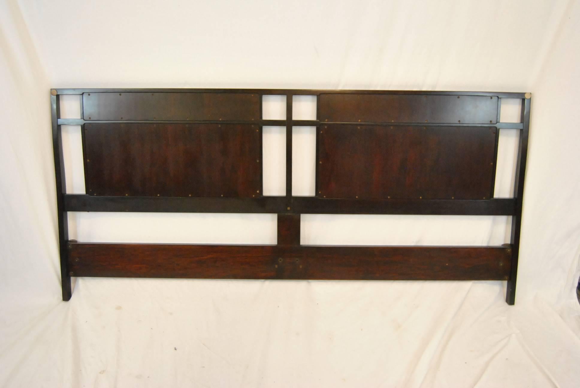 King-size headboard by Dunbar designed by Edward Wormley. Striking graphic panels of walnut and cane framed in a dark stained wood. Very nice pre owned condition. 80" wide x 37" tall.