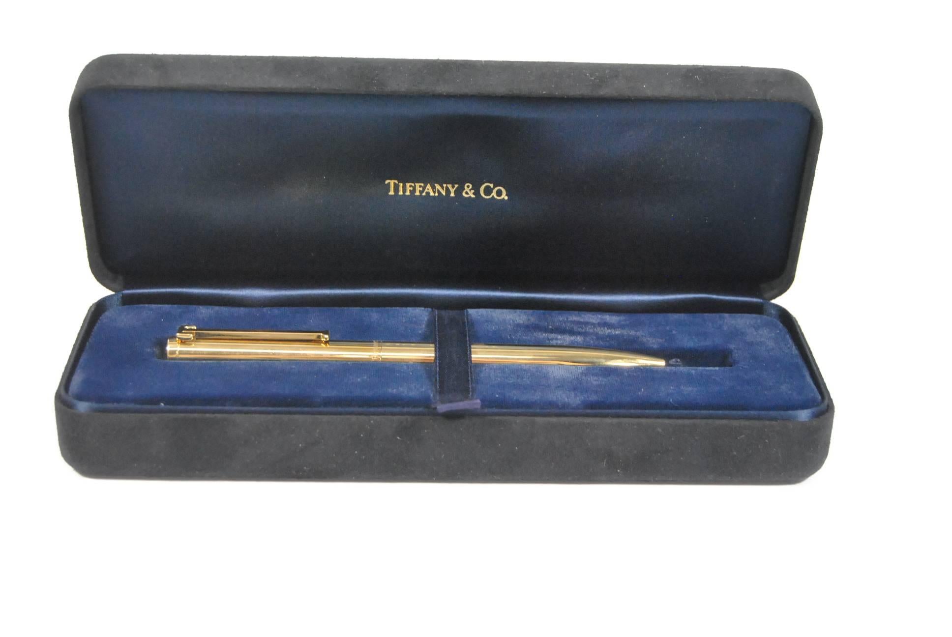 A beautiful 18-karat yellow gold ballpoint pin with "T" on the clip by Tiffany & Co. Pen is in original box. Weight is 39.7 grams and pen is 5 1/2" long. This would make a great gift for that very special someone.