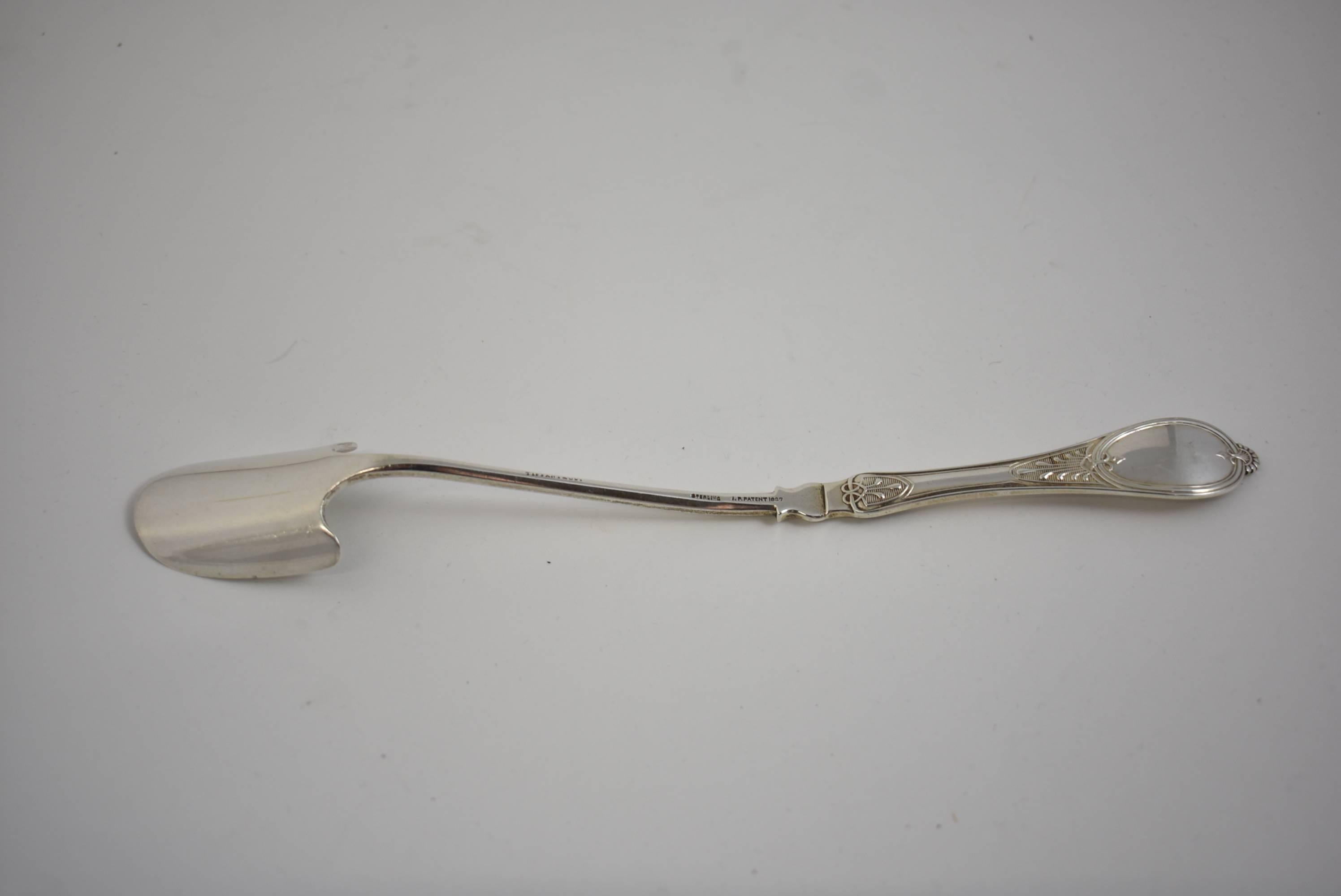 Antique Tiffany & Co. cheese scoop with patent pattern, 1887. Scoop weighs 65.8 grams. There is a monogram"LWL". Small nick on side of bowl.