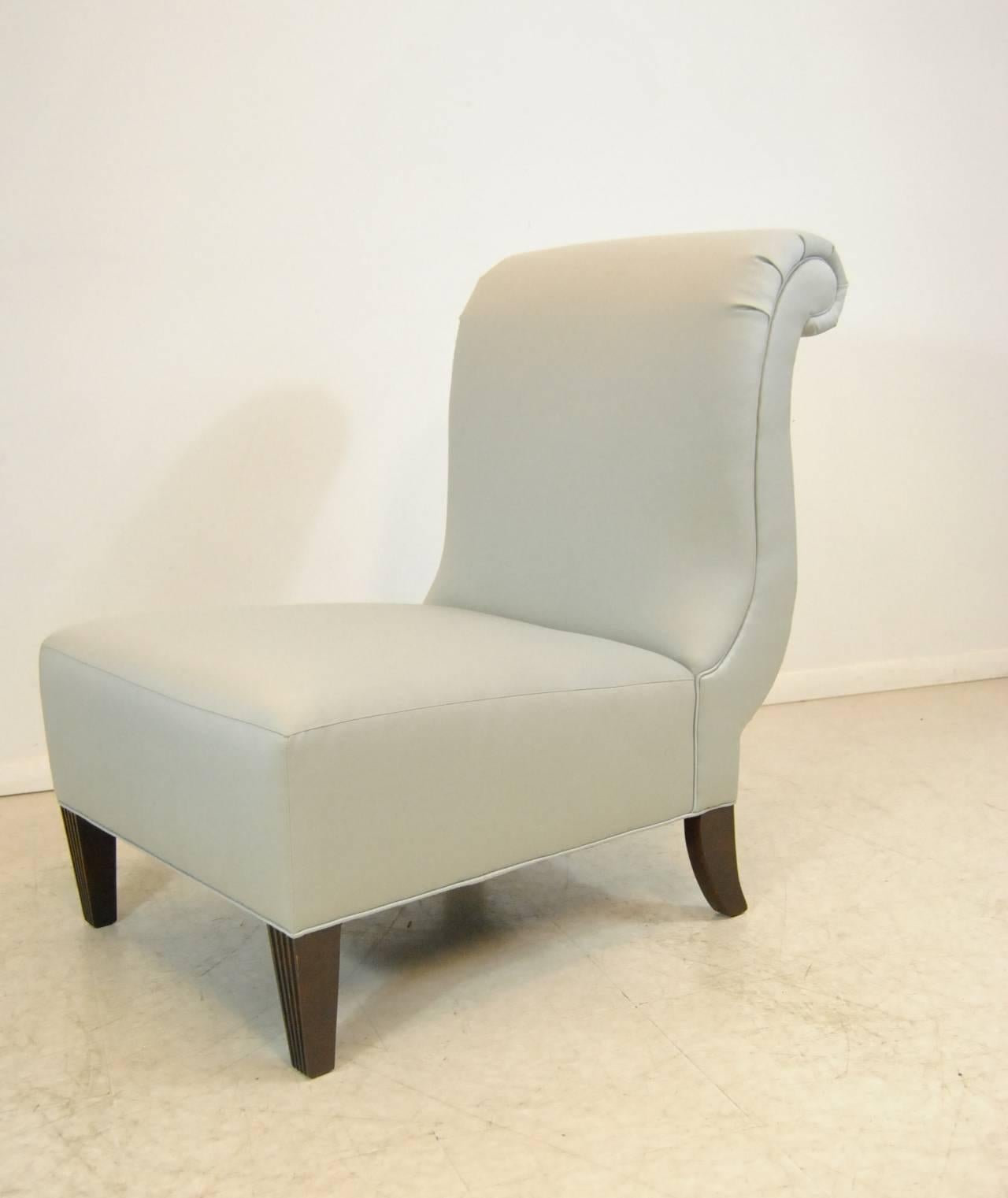 Light grey silk rollback slipper chair by Barbara Barry for Baker Furniture Company. Dark cherry finish on tapered fluted legs.