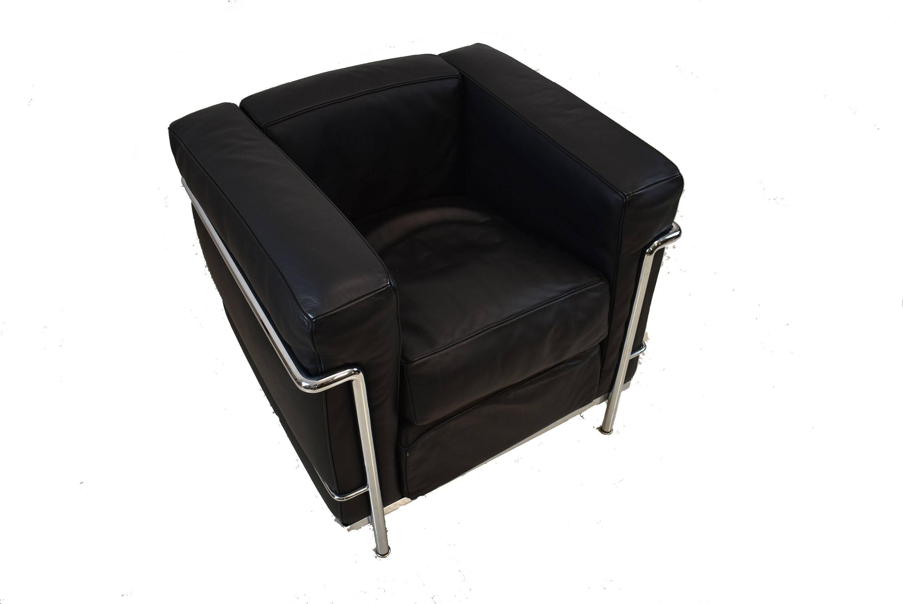 A stunning Mid-Century Modern LC2 Cassina LeCorbusier armchair. This unique chair features black leather cushions and a chrome frame. Stylish and sophisticated, sure to enhance your modern decor.