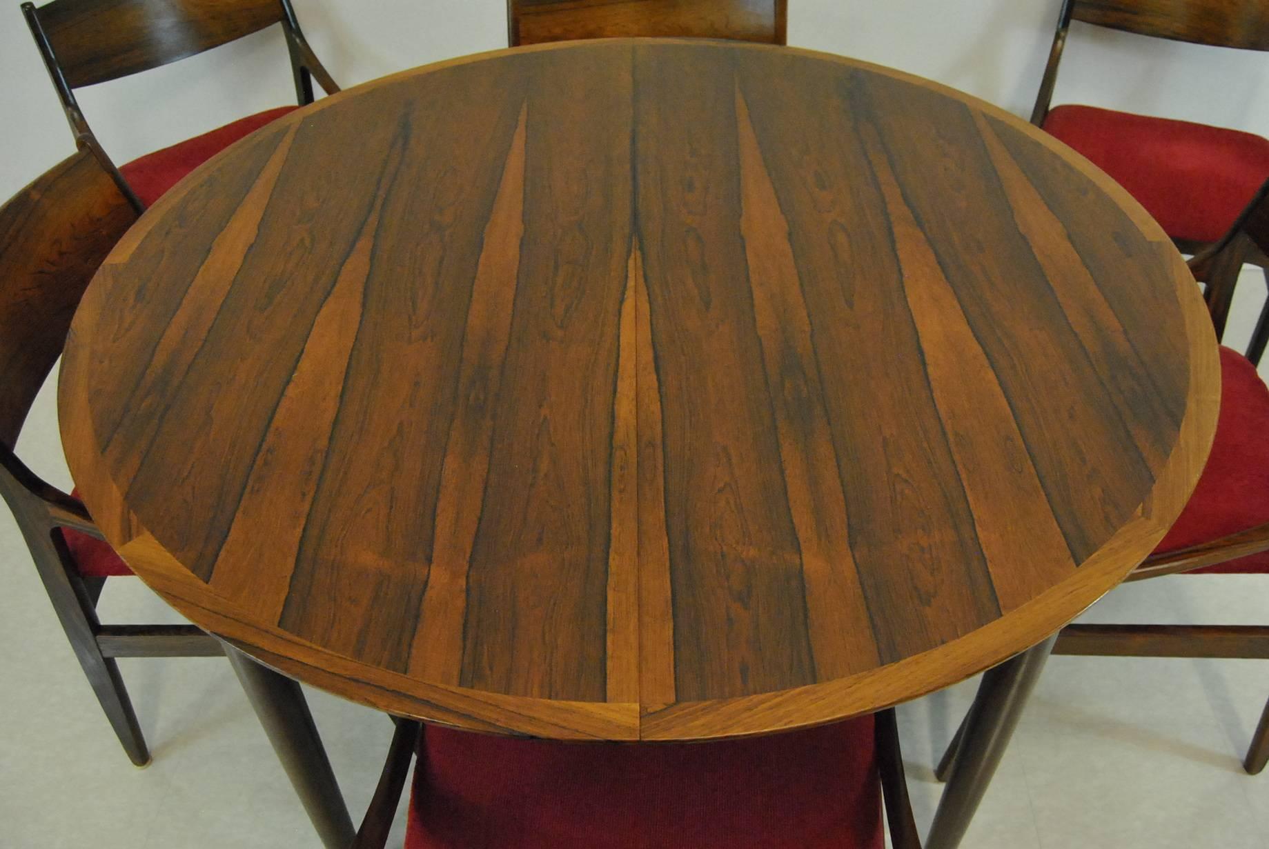 A beautiful Danish Modern rosewood dining set. Set includes a 48