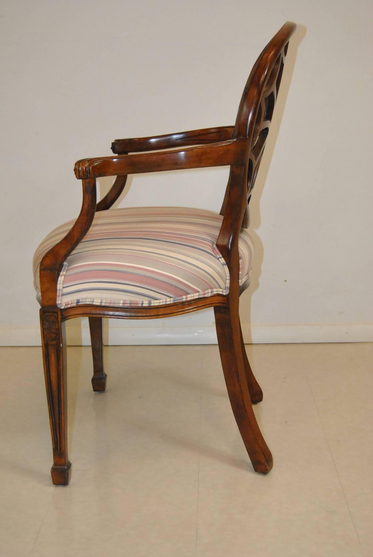 The spider web back accent chair by Sherrill Furniture has a mahogany wood frame and an elegant striped fabric seat. The unique details add interest and elegance. The perfect piece to add instant glamour to any space. The dimensions are 38