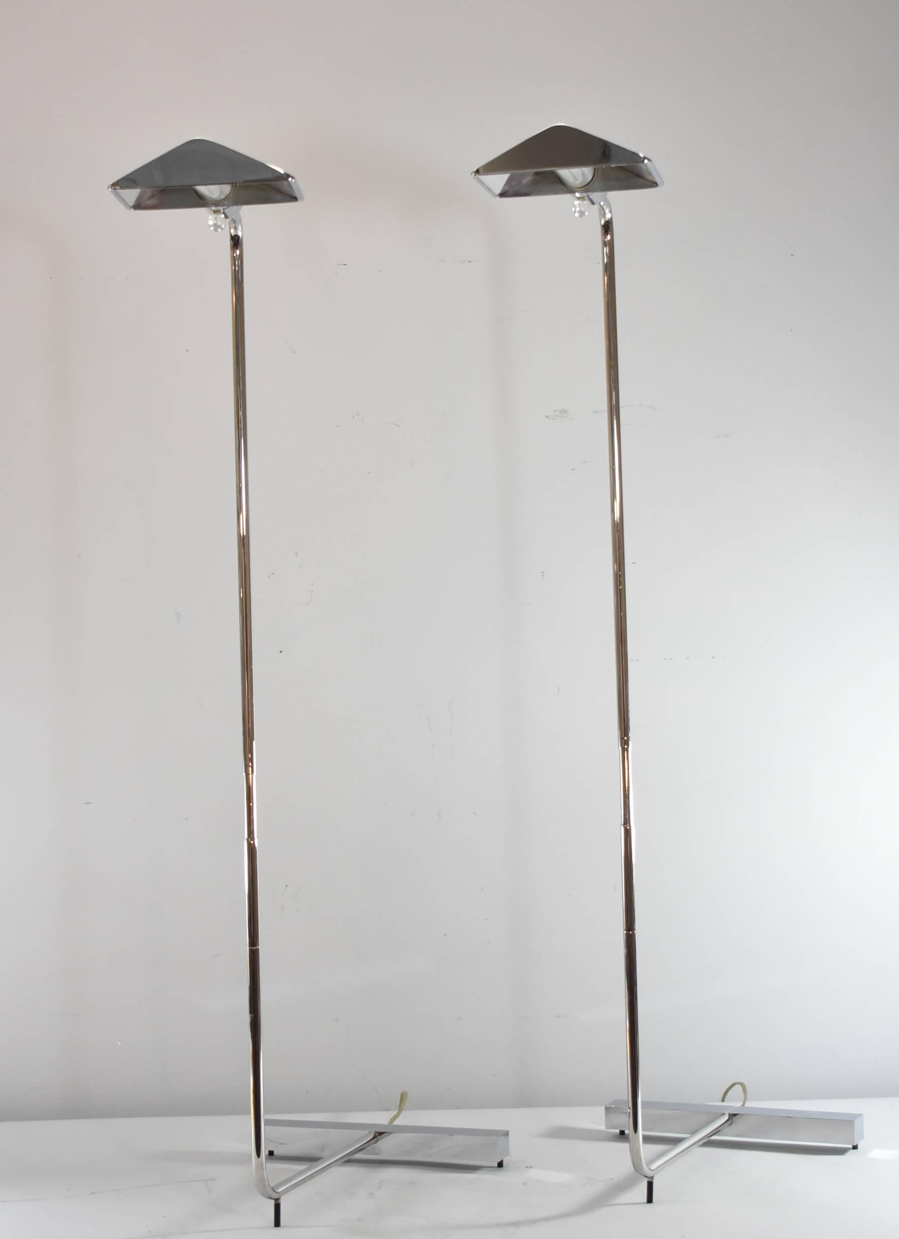 Mid-Century Modern chrome single socket signed floor lamps by Cedric Hartman. Shade swivels and the height is adjustable from 37