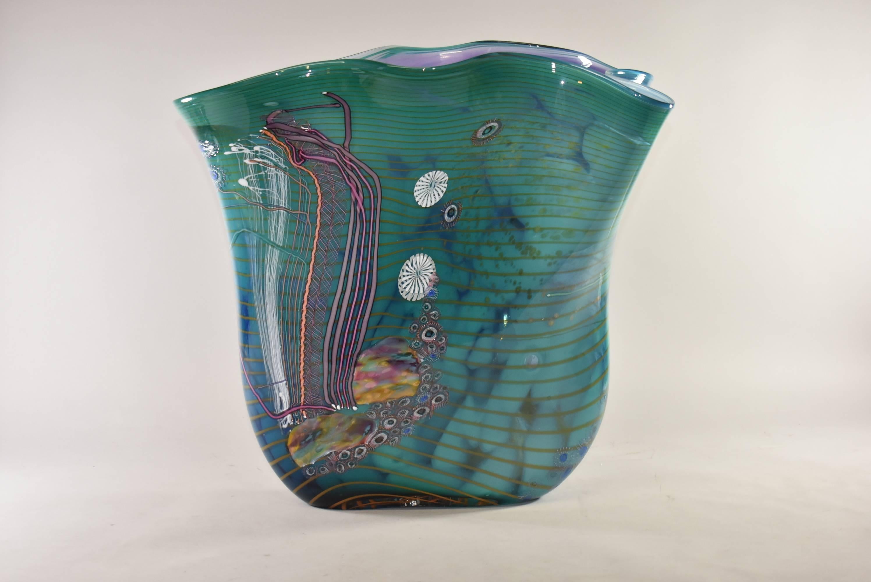 Impressive James Nowak (American, Born 1956) and Chris Hawthorne (American, Born 1953) studio glass artist collaboration vase depicting life under the sea. This beautiful aquatic scene vase features shades of teal, purple, blue and coral. Marked 89