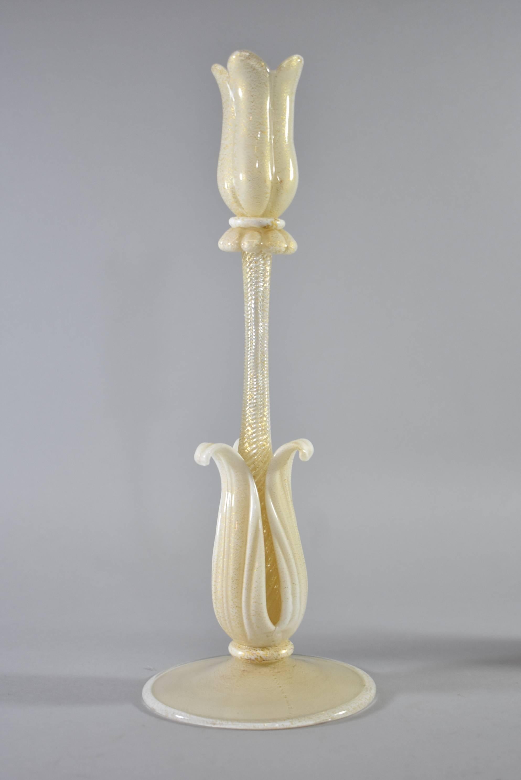 Extremely rare pair of petal-form white and gold Barovier & Toso Murano glass candlesticks. The white foot accented with gold flake issuing a petal form gold stem. The dimensions are 12.25