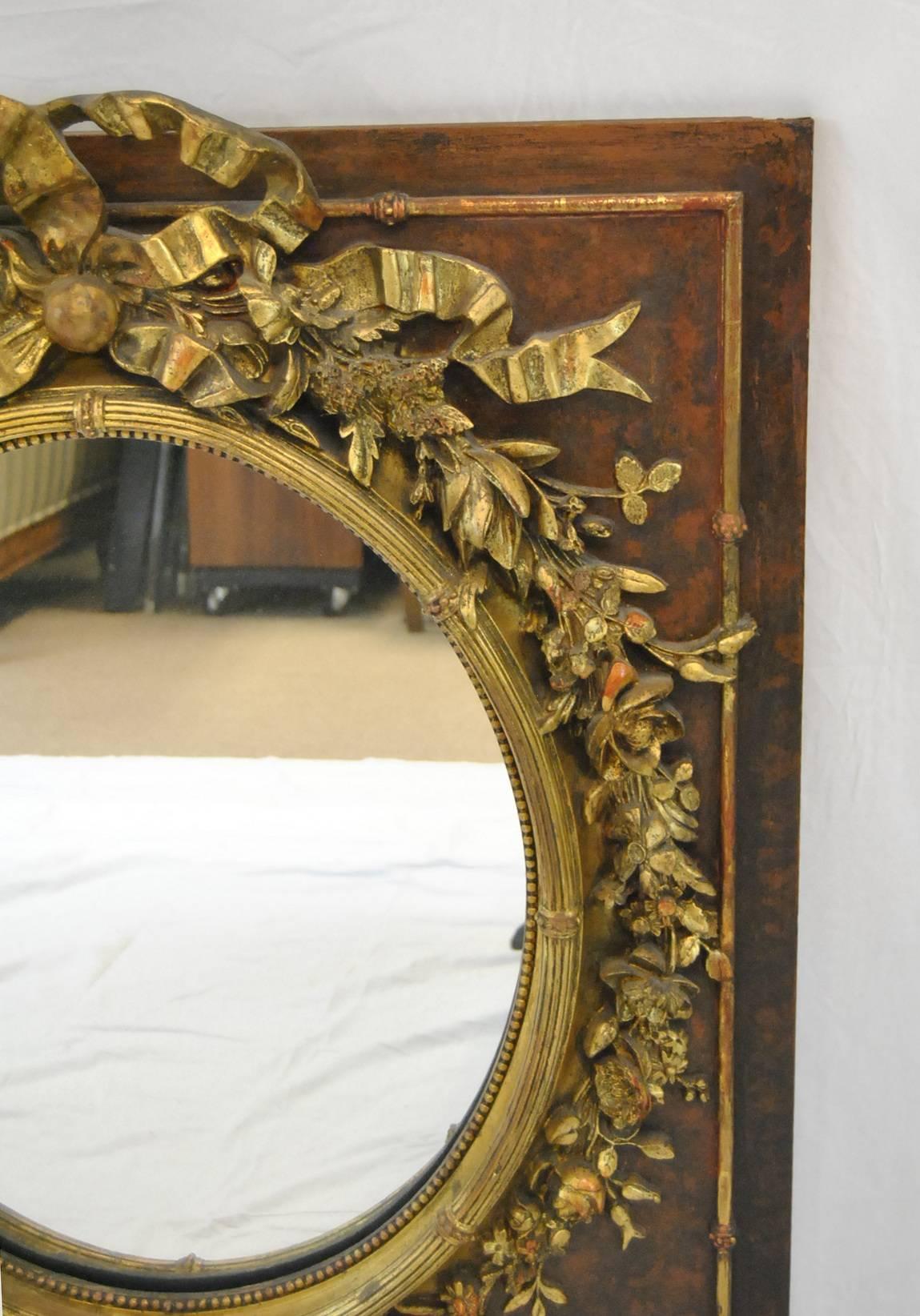 Late Victorian Victorian Oval Mirror with High Relief Floral Detail and Central Bow