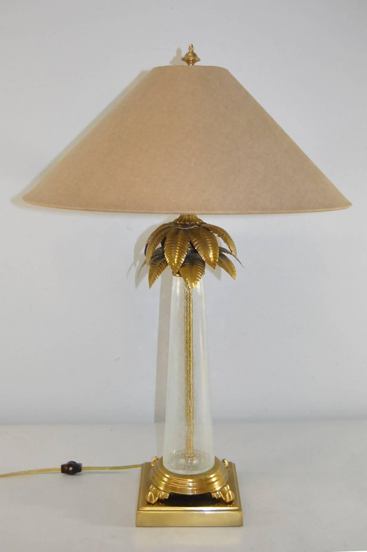 A beautiful hand blown glass table lamp by Frederick Cooper.  This lamp features a brass palm tree detail.  The lamp is signed Frederick Cooper.  The Shade Is Not Included.  