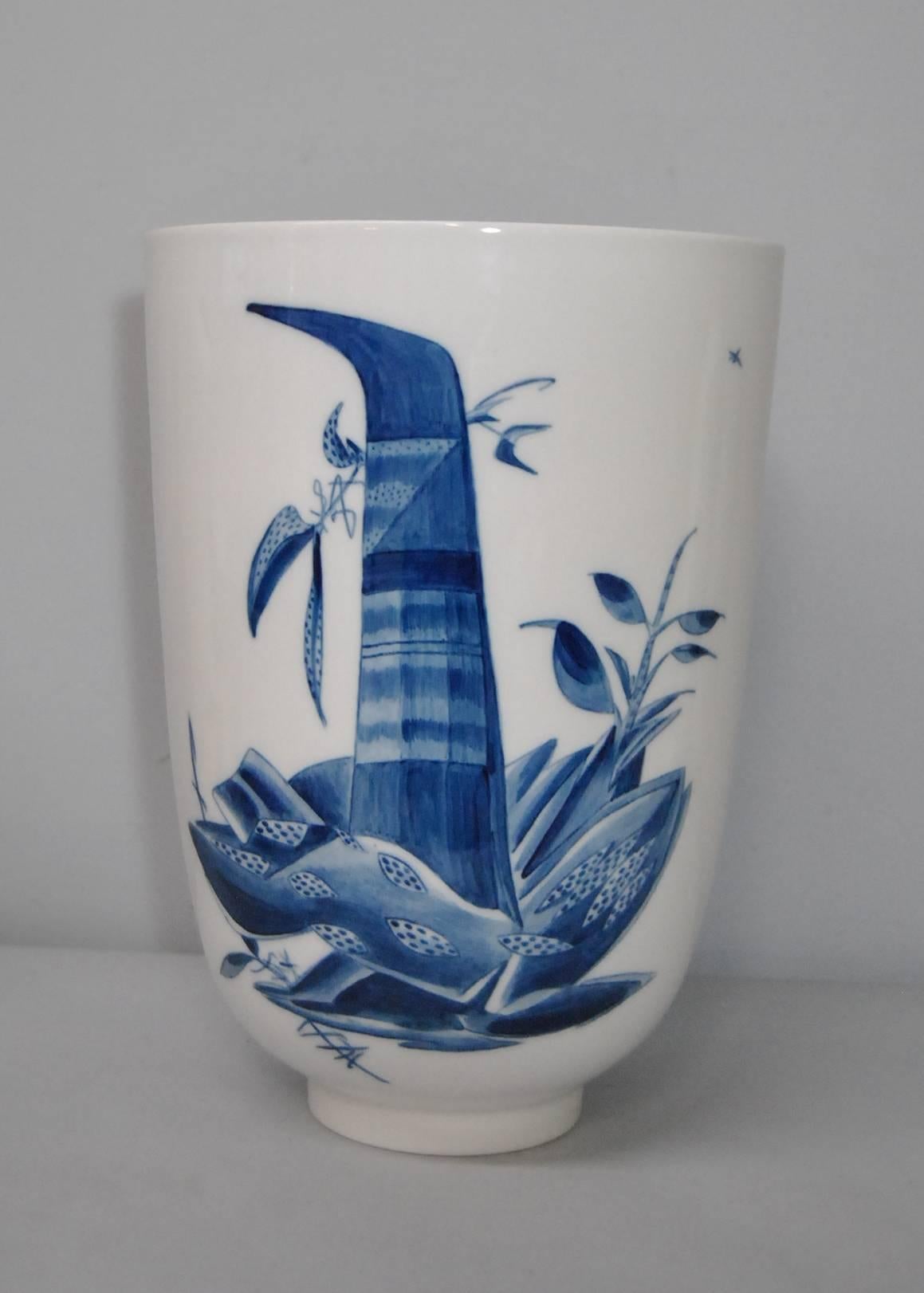 This is a large floor vase designed by Thorkild Olsen c1890-1973 for Royal Copenhagen.  This has an abstract plant pattern in blue on a white background.  This is a large vase being 18" tall by 13" in diameter at top narrowing to 6"