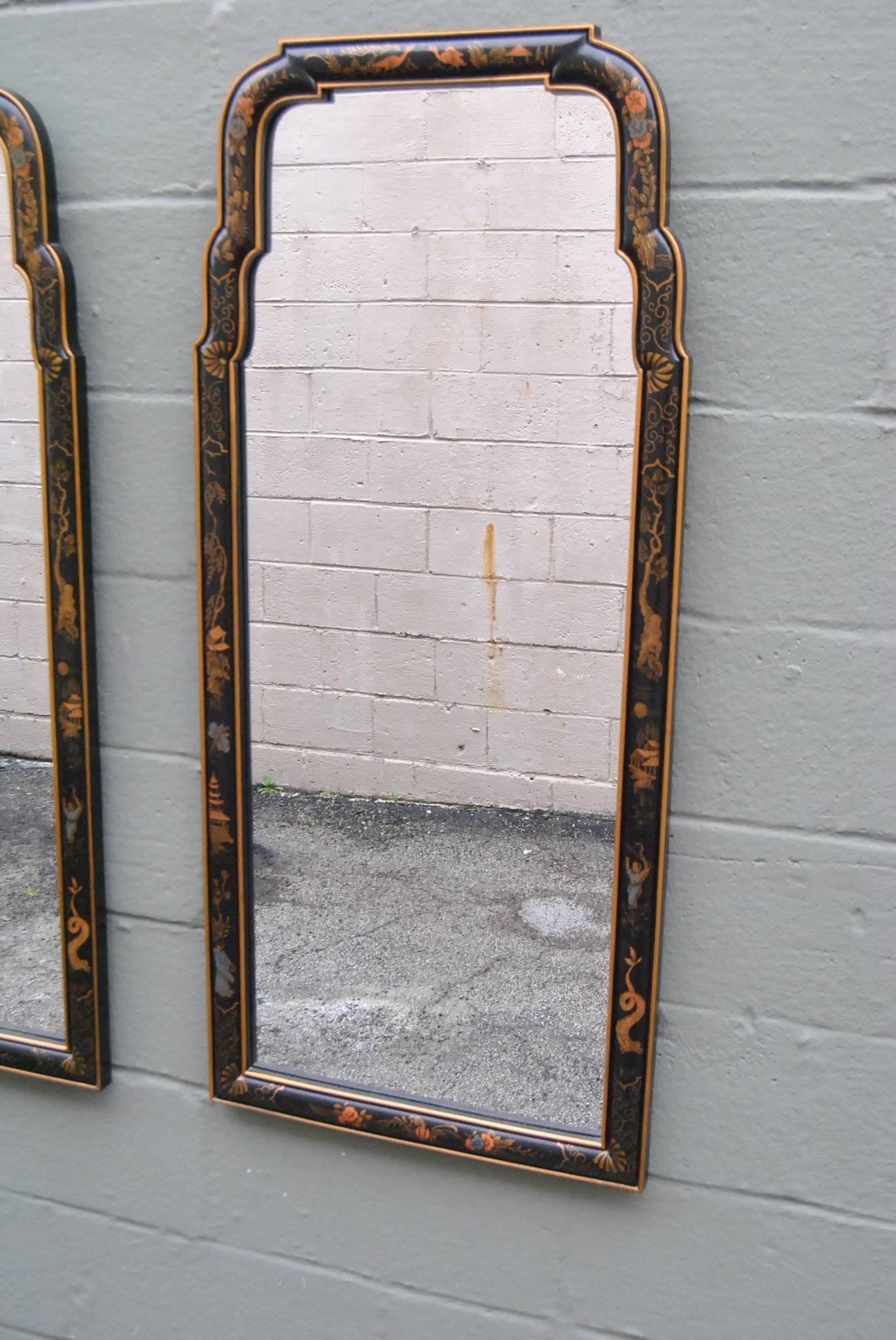 Beautiful pair of Drexel mirrors in black and gold. Asian Style chinoiserie with painted butterflies, trees, ducks and pagodas. Very nice+ pre owned condition. No silver loss.
