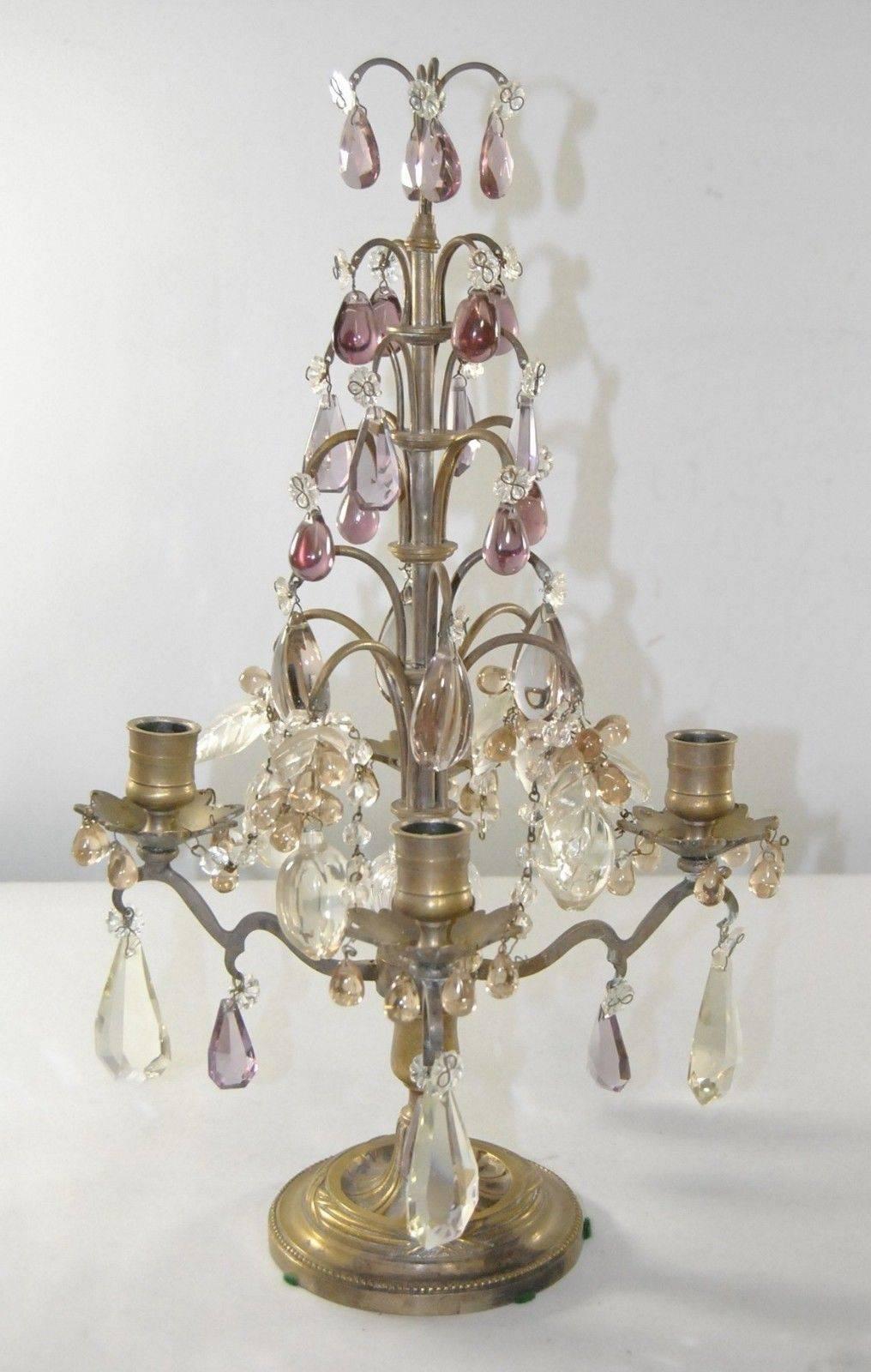 Antique pair of four-arm candelabra with original nickel plate finish, circa 1920s. Beautiful vintage cut-glass amethyst crystals with larger drops of pale lilac. Four clusters of leaves with one large plum surrounded by light apricot drops. Base