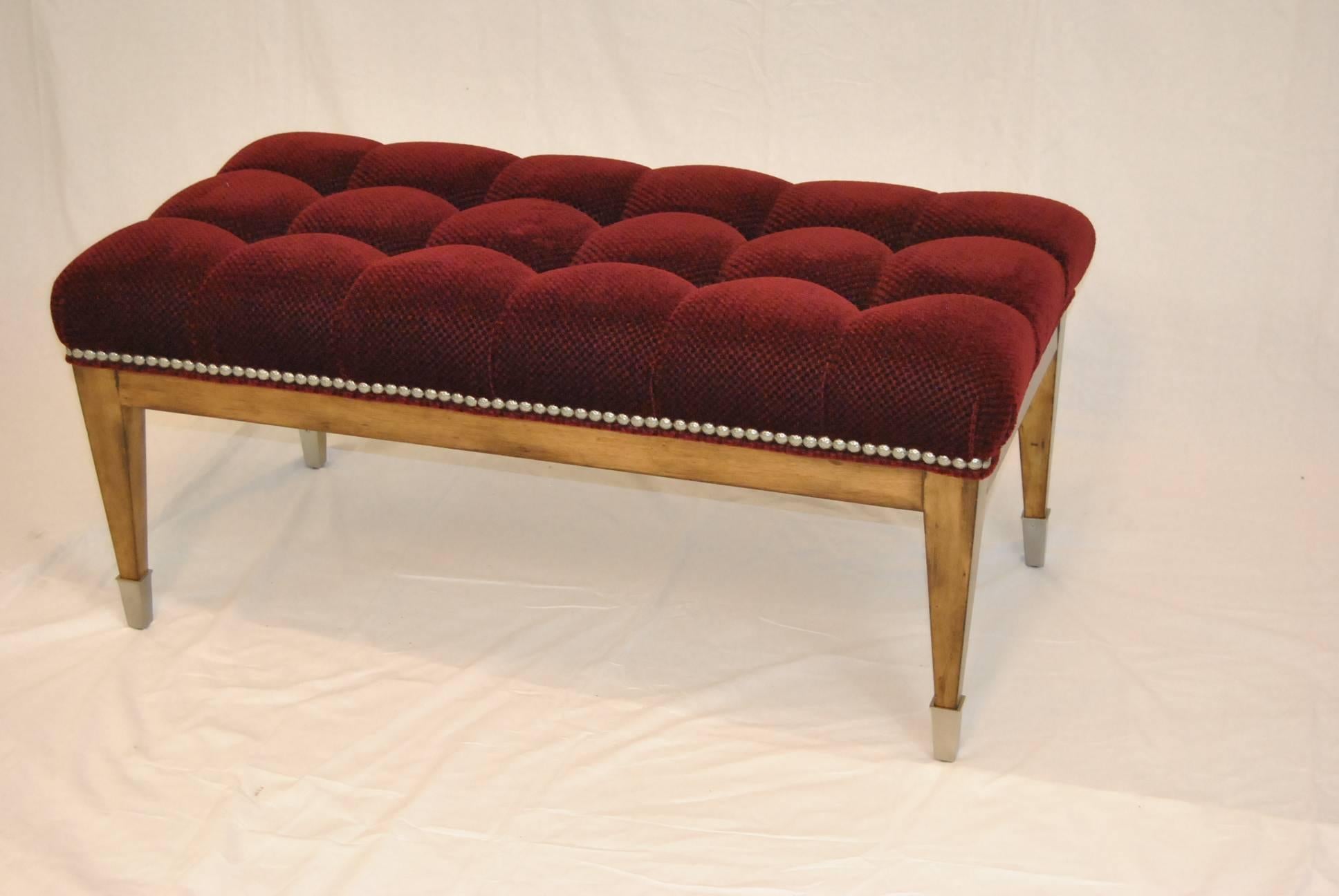 An attractive upholstered mohair bench by Swain. It features ample cushioning, a solid wood frame, burgundy mohair cover, pewter feet caps and nailhead trim. Very good condition with very minimal wear.