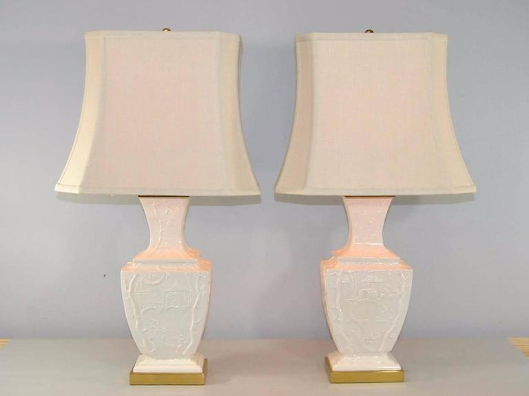 White Porcelain Lamps With Embossed Asian Detail And Brass Base By Chinoiserie White Porcelain Lamps With Embossed Asian Detail And Brass Base By Paul Hanson For