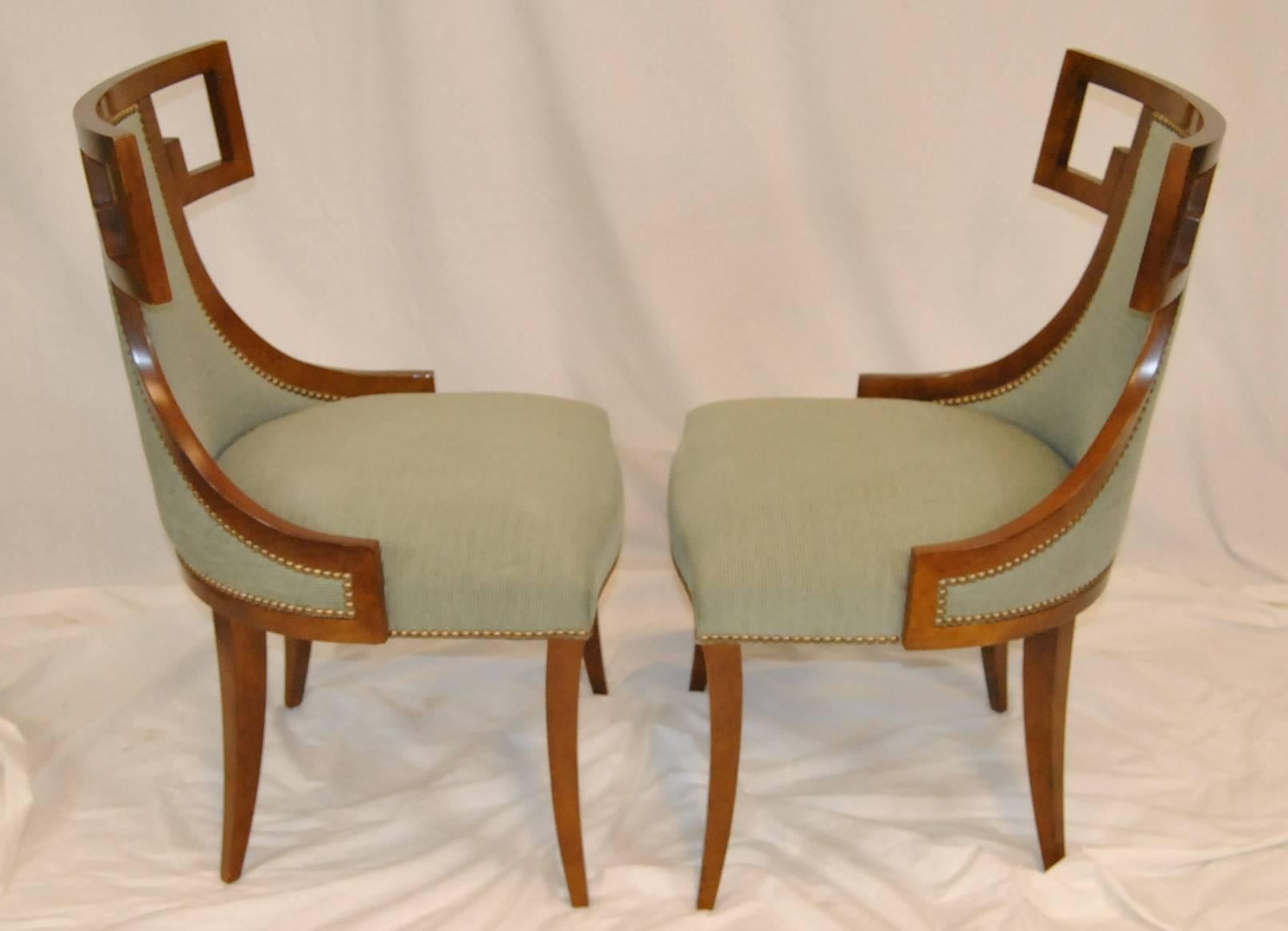 This is the Greek dining chair model #6341 designed by Thomas Peasant for Baker Furniture. Very elegant lines with Greek Key feature at crown. Upholstery is seafoam green with nailhead accent. There are eight in the set. Each chair measures 36