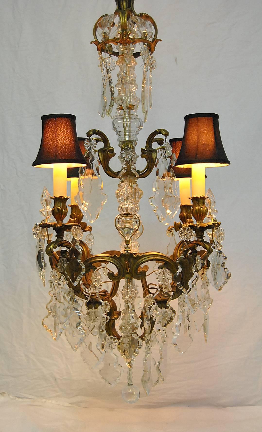A beautiful large-scale French bronze chandelier with large shaped cut crystal accents. This chandelier is 43