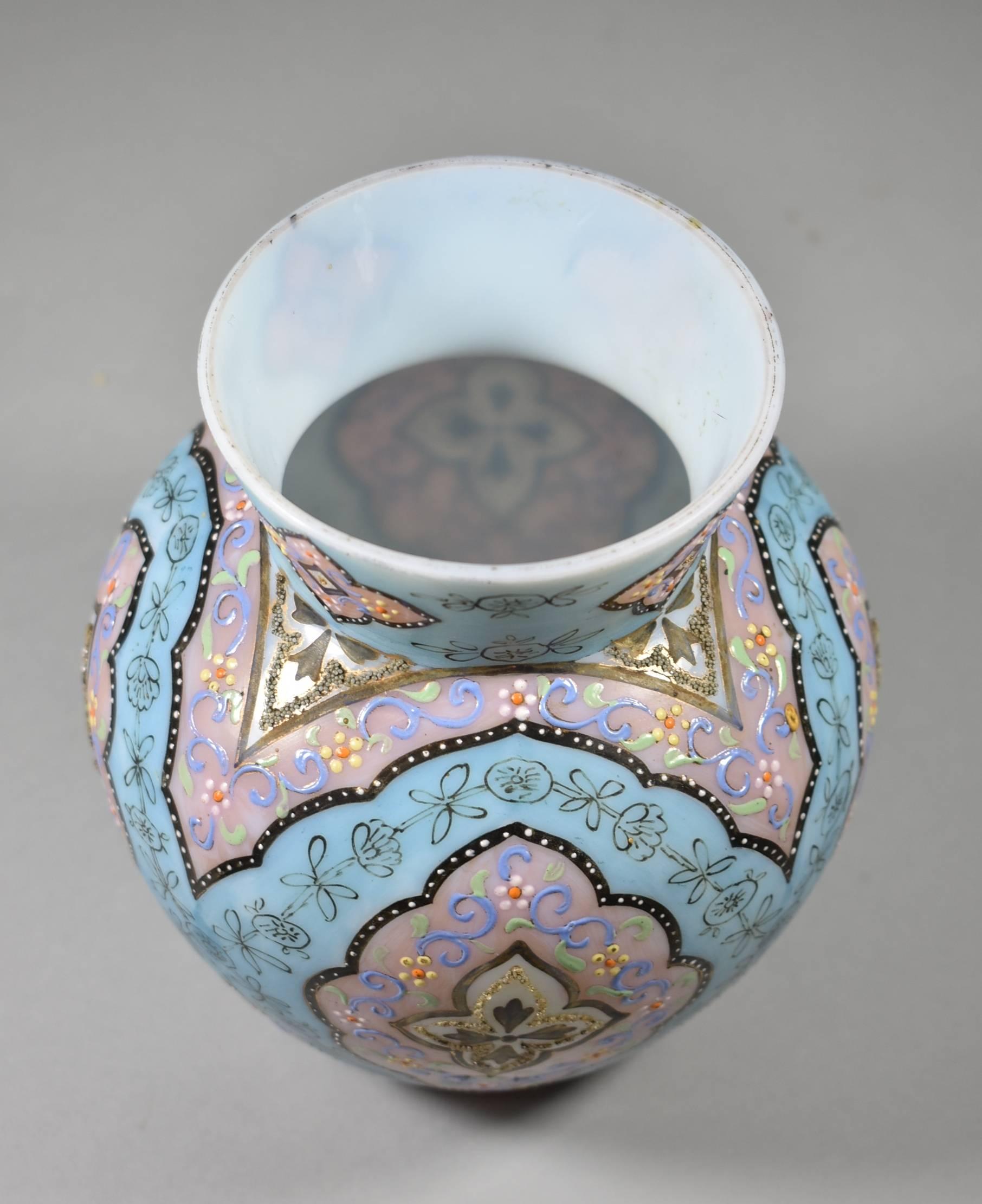A beautiful Moroccan Pattern orientalist Persian enameled art glass vase by Webb. The vase is 6.5" tall and 3.5" in diameter (at opening). The turquoise and rose colored background is accented with blue, black and gold enamel work. This