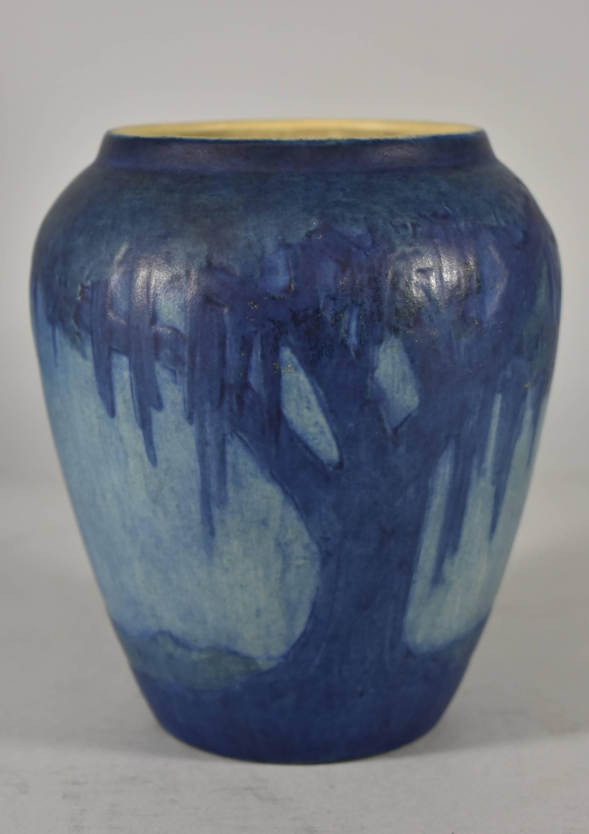 A beautiful, well executed Newcomb College vase. This vase is done in rich deep tones of blue with Spanish moss trees and a full moon. It is 6
