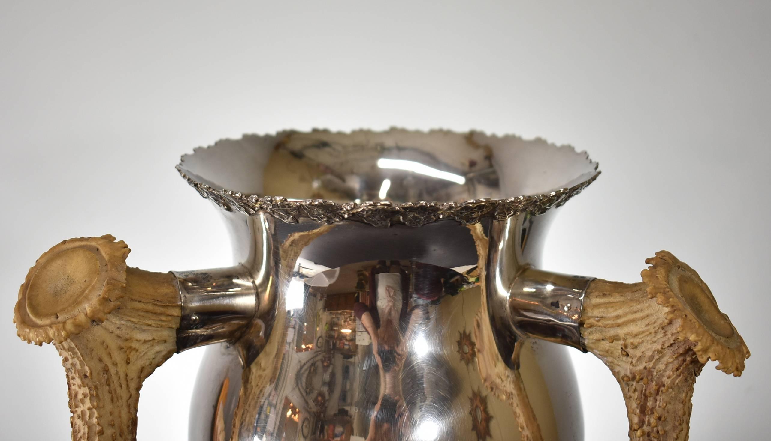 Unusual large sterling silver trophy cup with three Horn handles by Dieges & Clust, New York. Dieges & Clust was established in 1898 and was the countries premiere maker os stock and figural trophies from 1905-1930. This trophy is clearly marked on