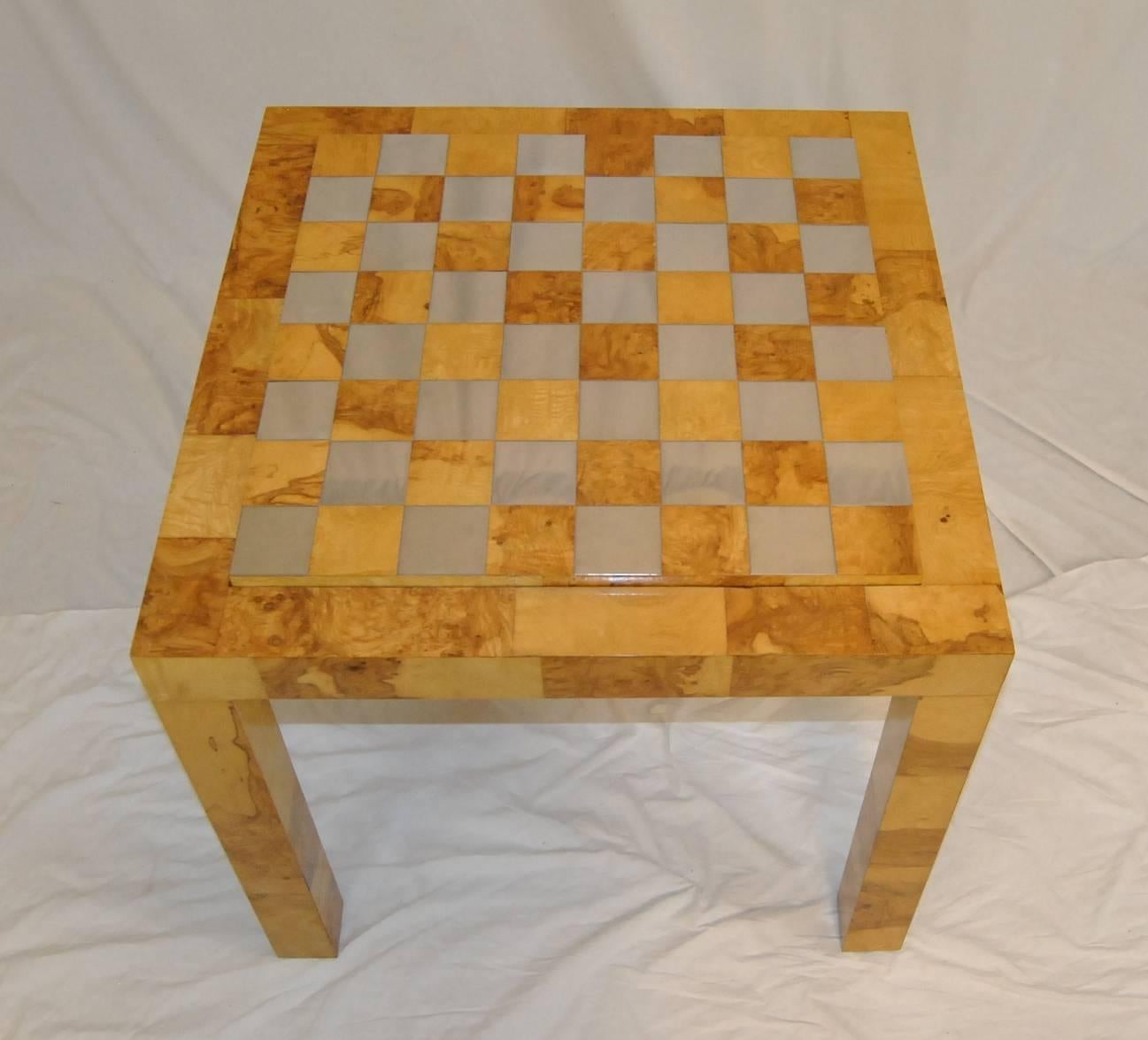 Beautiful game table by Paul Evans. The burl wood table has a top which reverses from a polished brass and burl board to a black laminate top. Spectacular lines on this table so typical of Paul Evans design.