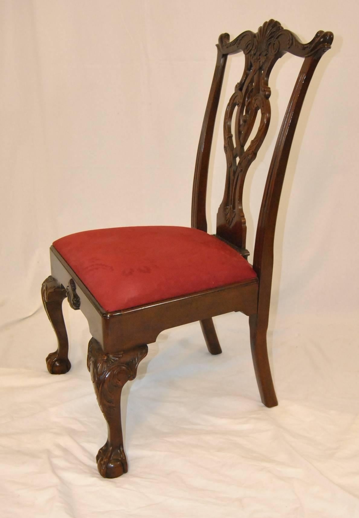 A great set of mahogany dining side chairs by the Century Furniture Company. These are the "Philadelphia Tassel" chairs and are reproduction of a 1760 chair owned by the Supreme Court Justice Samuel Chase. They are extra wide and heavy and