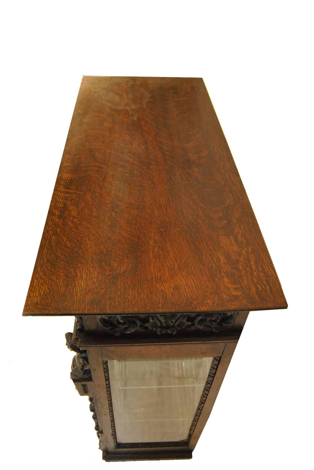 Heavily Carved Gothic Revival Oak Counter Display Cabinet, Figural Carvings In Good Condition In Toledo, OH