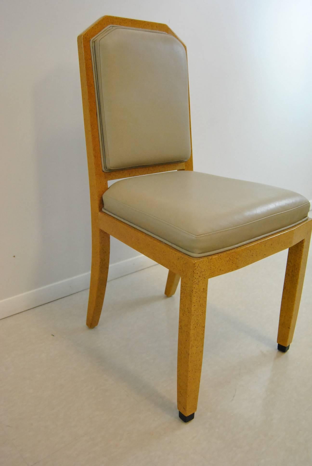 Set of eight dining chairs by William Switzer. Featuring an elegant hand-carved frame created in Spain and finished in Vancouver, these chairs are timeless. They offer comfort and style when dinner conversation runs long into the evening. The