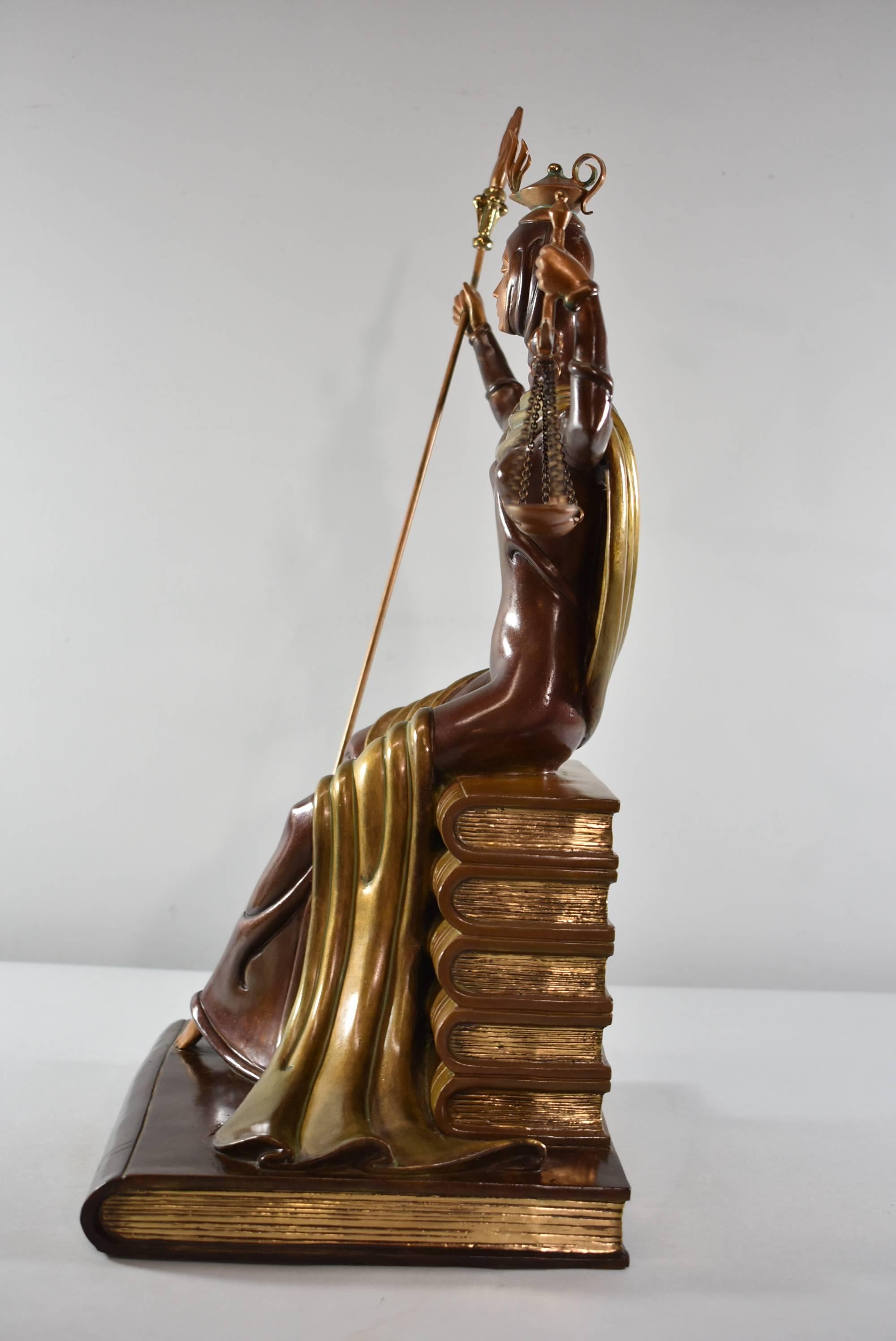 A beautiful bronze by Erte. Named Lady Justice this is number 25 from a limited edition of 60. It depicts lady justice sitting on a stack of books with a staff and scales. Signed Erte in the bronze on base, and marked A/P 25 / 60, fine art
