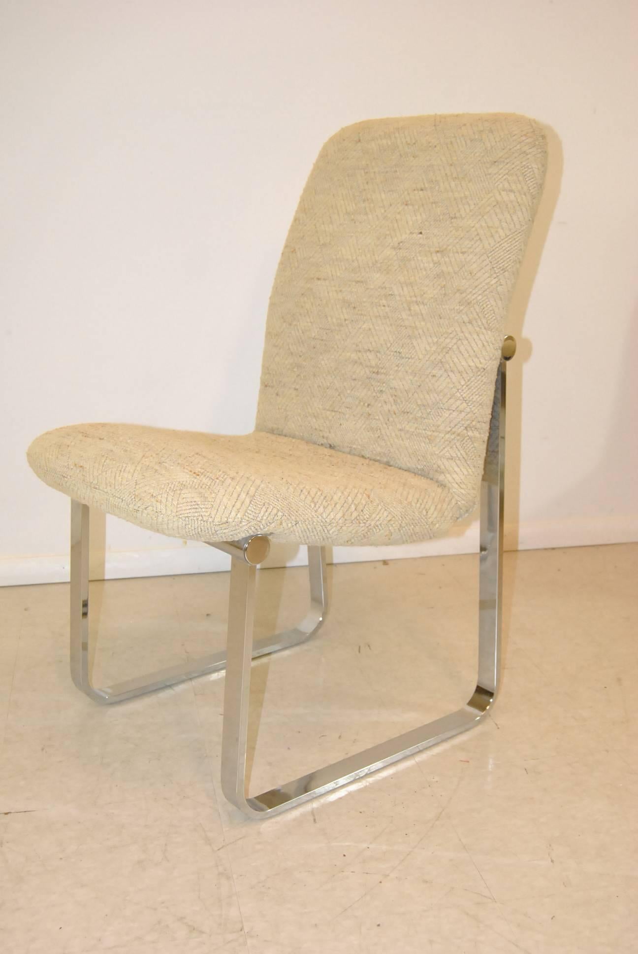 A great set of six D.I.A. dining room chairs. They feature heavy chrome frames and a very pleasant wool upholstery. Very good condition with one chrome disc missing from one chair. The upholstery is in excellent condition with no stains. The
