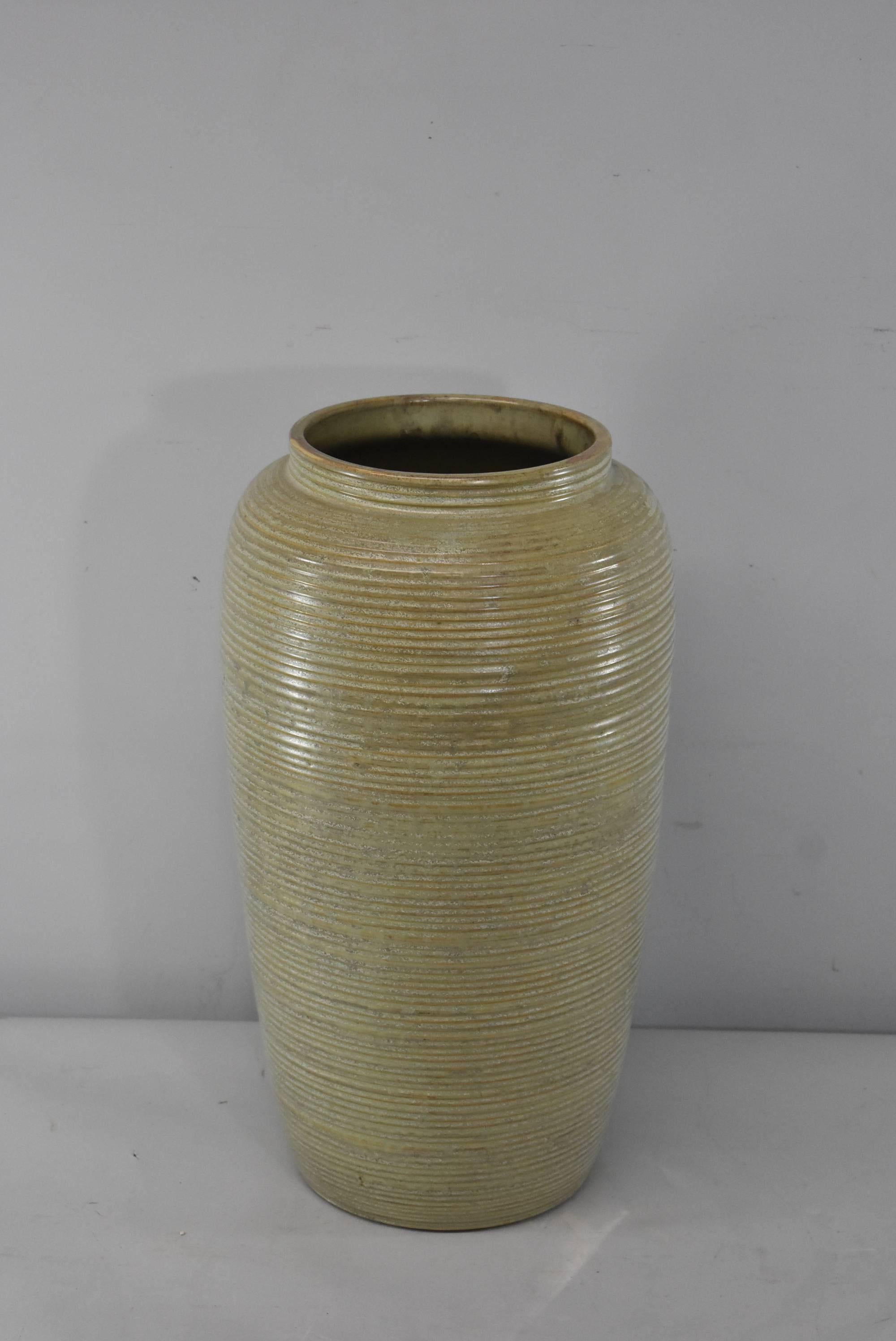 A Mid-Century Monmouth Pottery floor vase, circa 1950. A large form monochromatic glazed pottery vase with ribbed detail in a grey/green shade. Very good condition. Dimensions: 8.5
