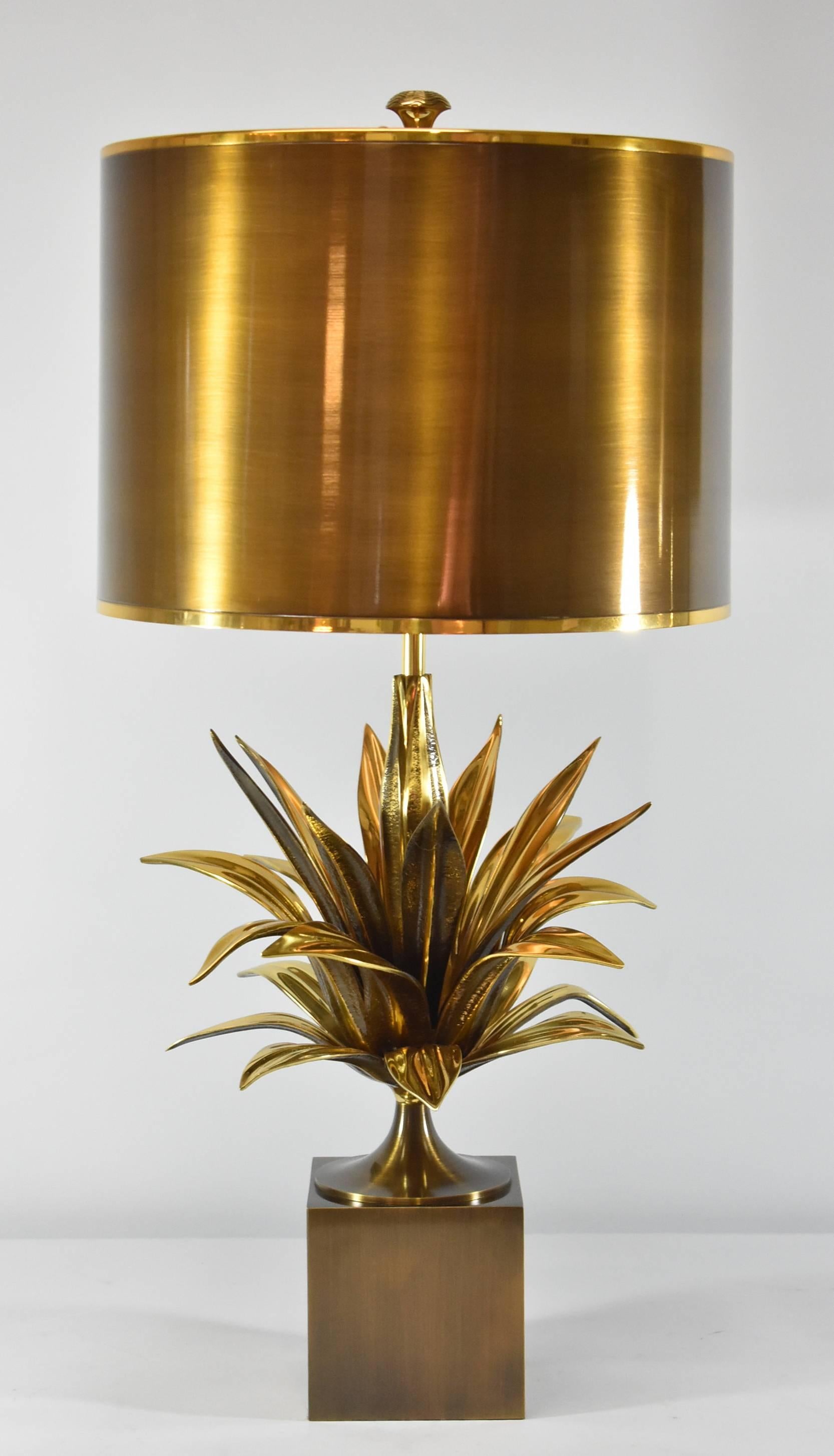 A cast bronze and gold metal table lamp with a plant theme by Charles Paris. These are 