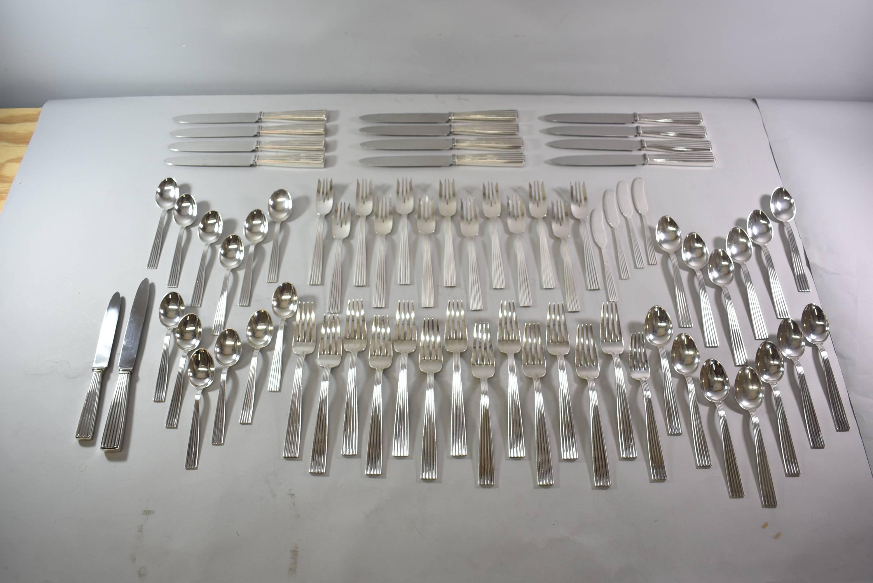 Tiber by Buccellati made in Italy sterling silver flatware set with serving pieces. Included are 70 pieces. 13 dinner knives, 14 dinner forks, 8