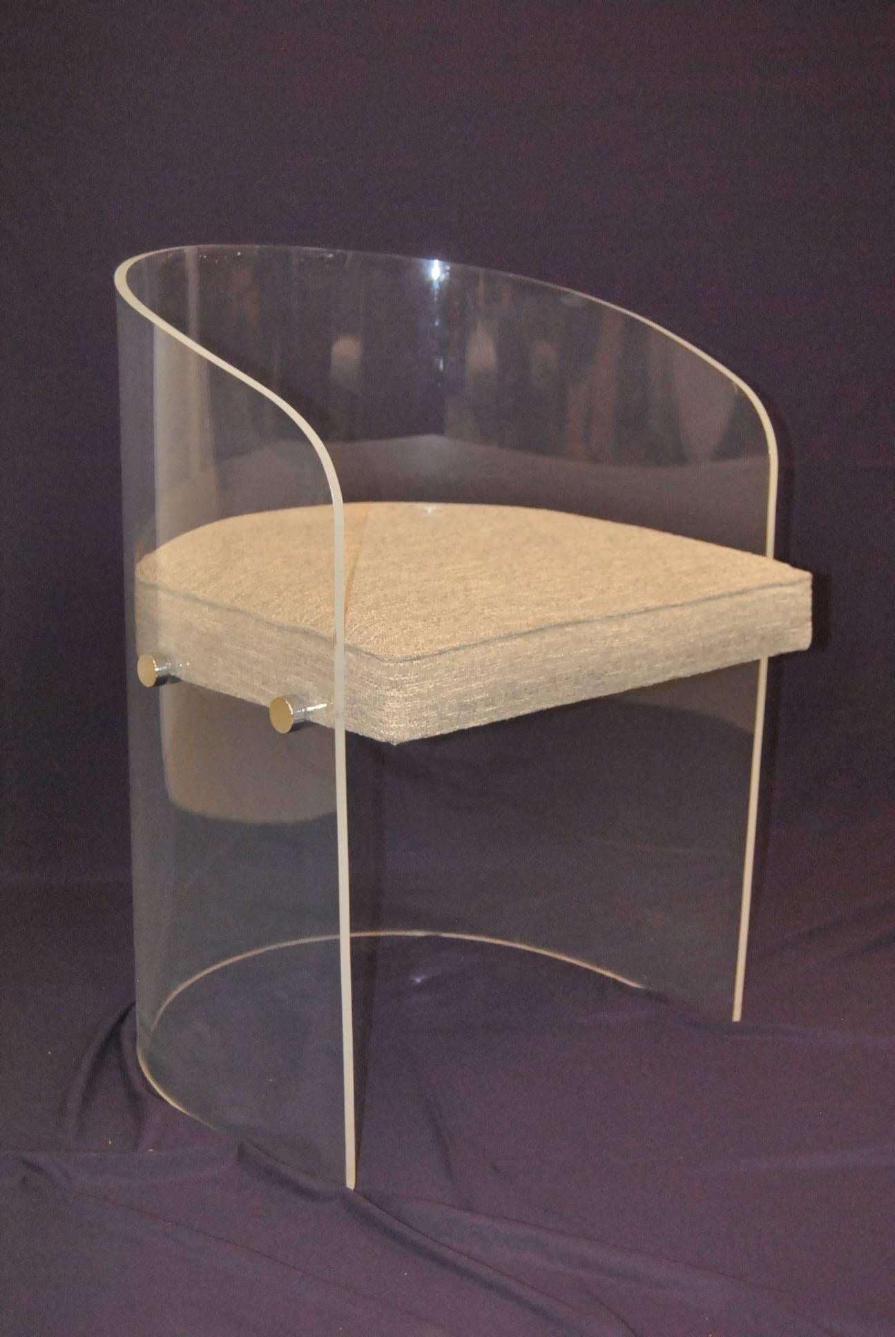 A great set of four Lucite barrel chairs. These fantastic chairs feature a heavy 3/8