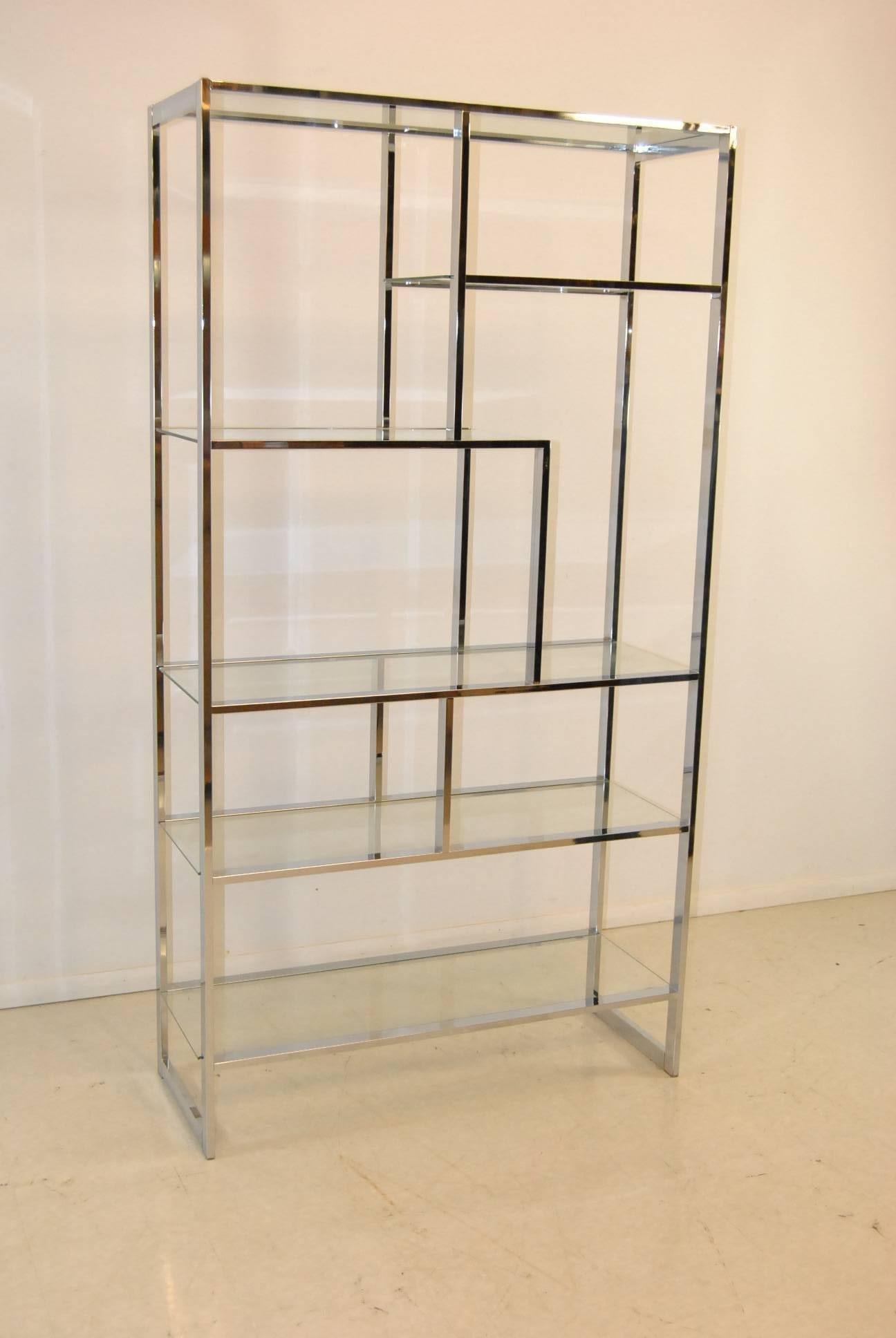 A very stylish glass and chrome floating shelf. Clean modern lines that would be perfect for your modern decor. The dimensions are 42