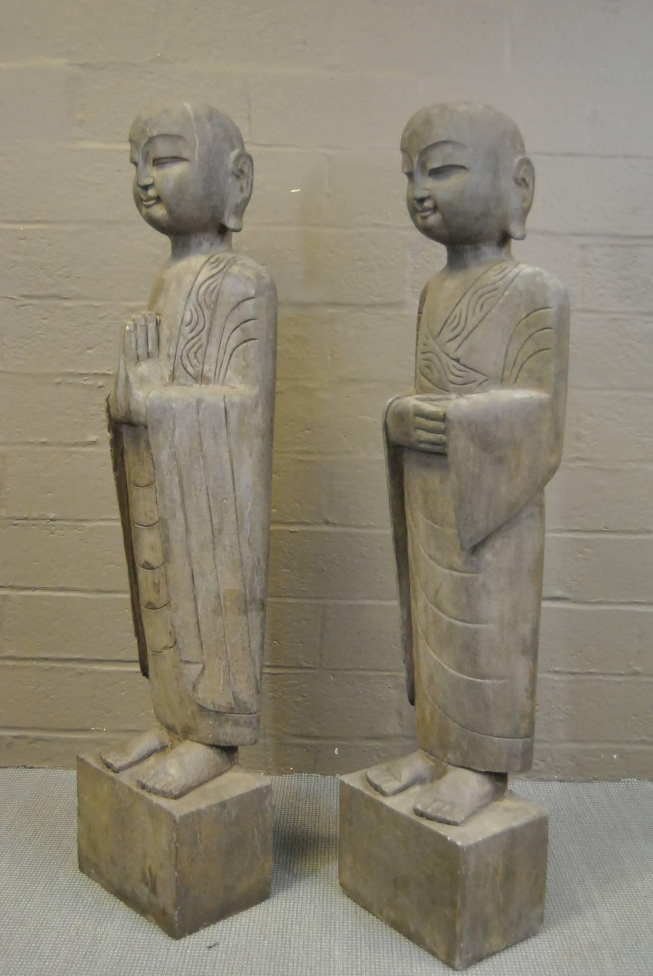 A pair of exquisite carved hard stone Asian figural statutes or sculptures. These figures depict two of the 18 Lohans or Arhats, who were the personal disciples of the Buddha and are characterized by their eccentricity and supernatural powers. These