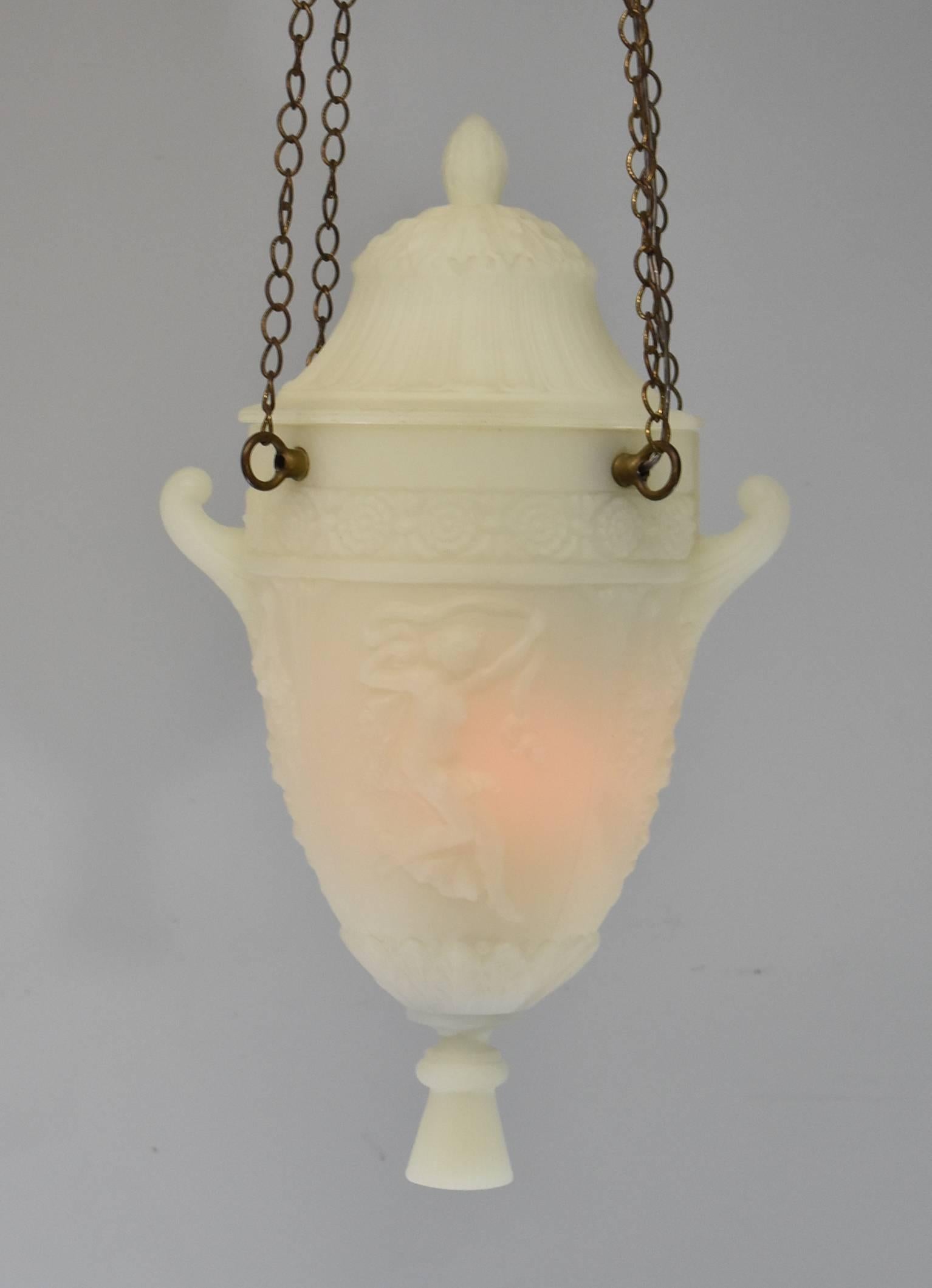 A beautiful white frosted Grecian urn style chandelier. Suspended from four chains this gorgeous light fixture features two handles with floral detail, Greek female figures and fluted panels with anthicus leaves. Casted glass with a removable lid.