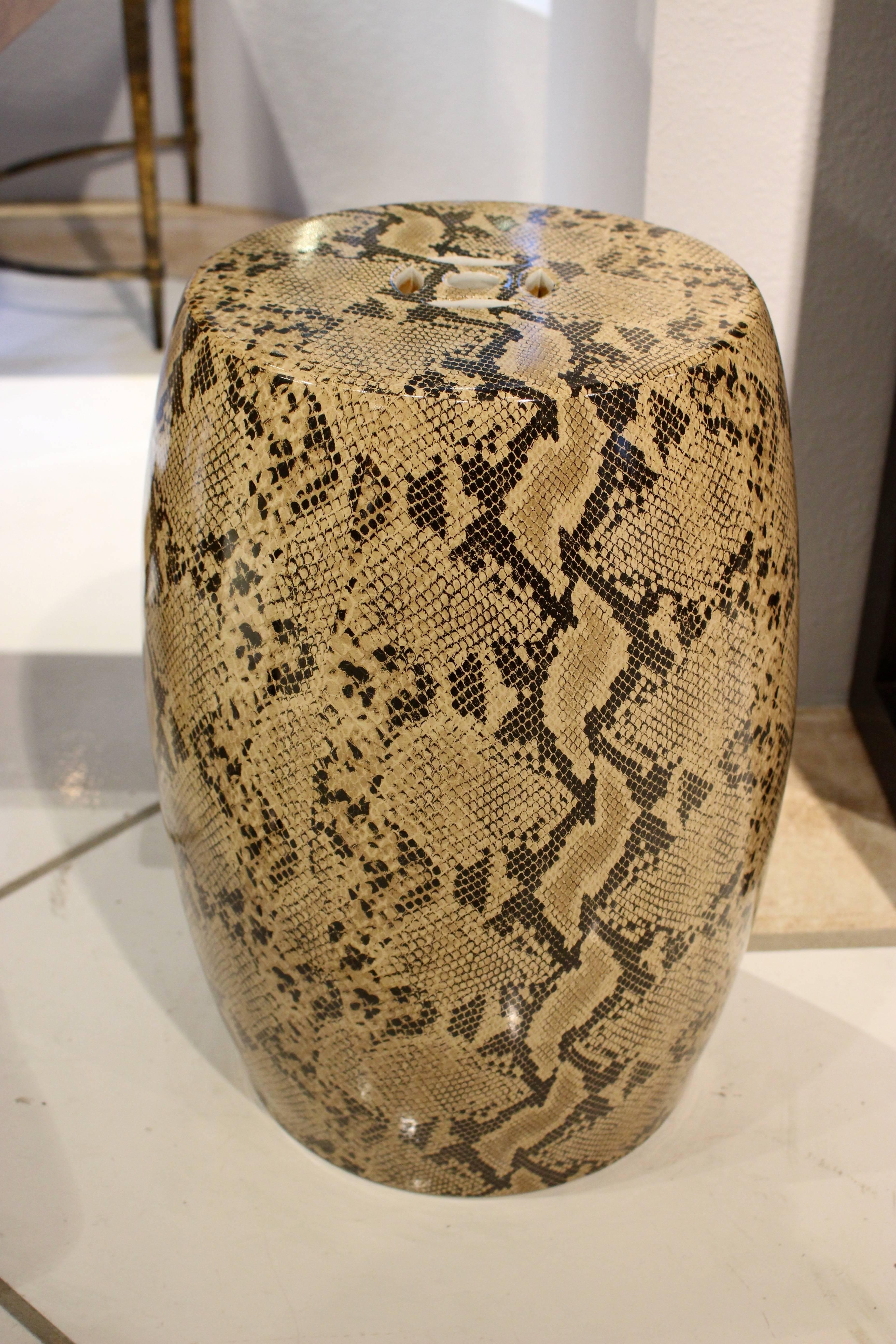 Ceramic stool with snakeskin design.