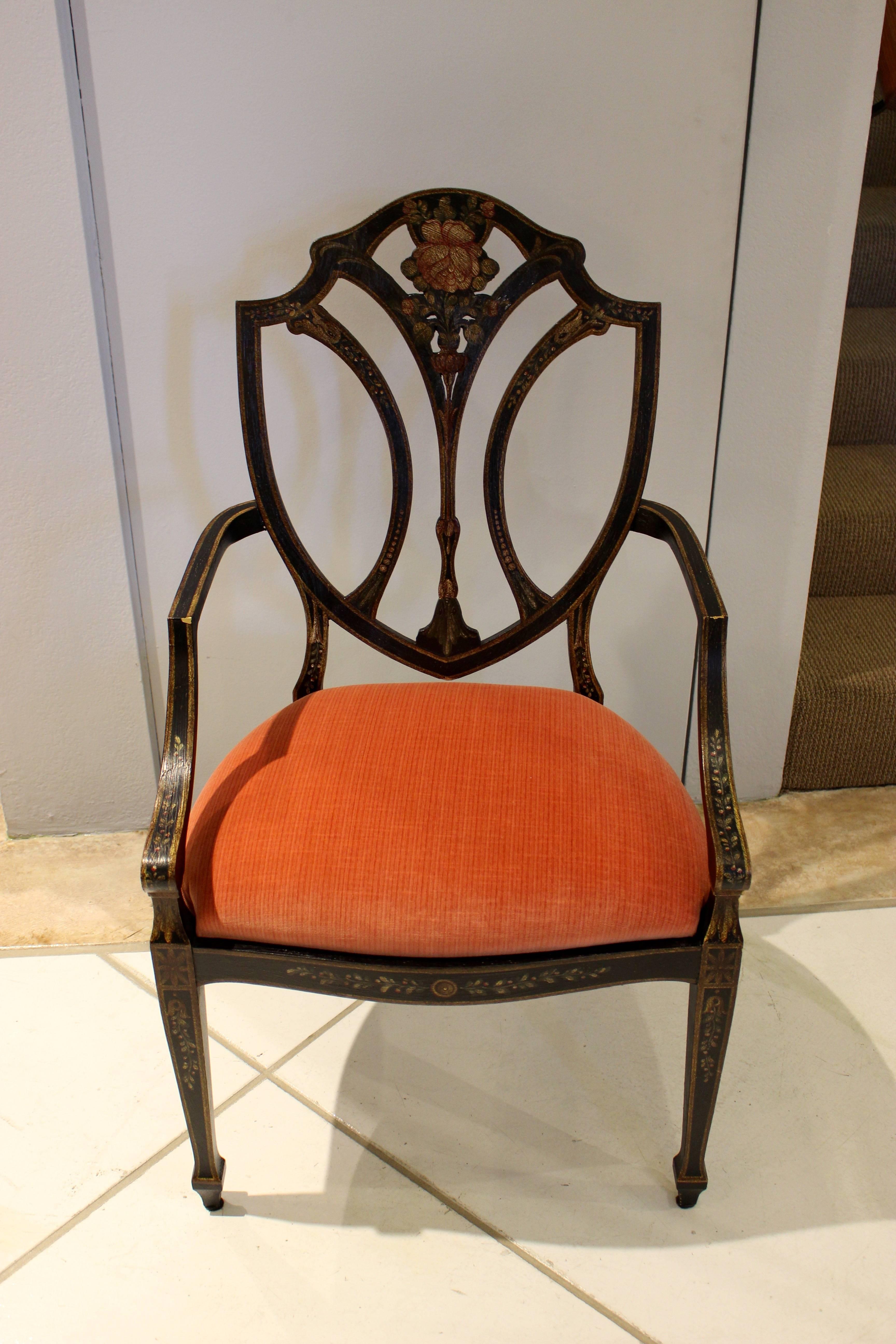 Set of six modern English shield-back chairs with flower motif.