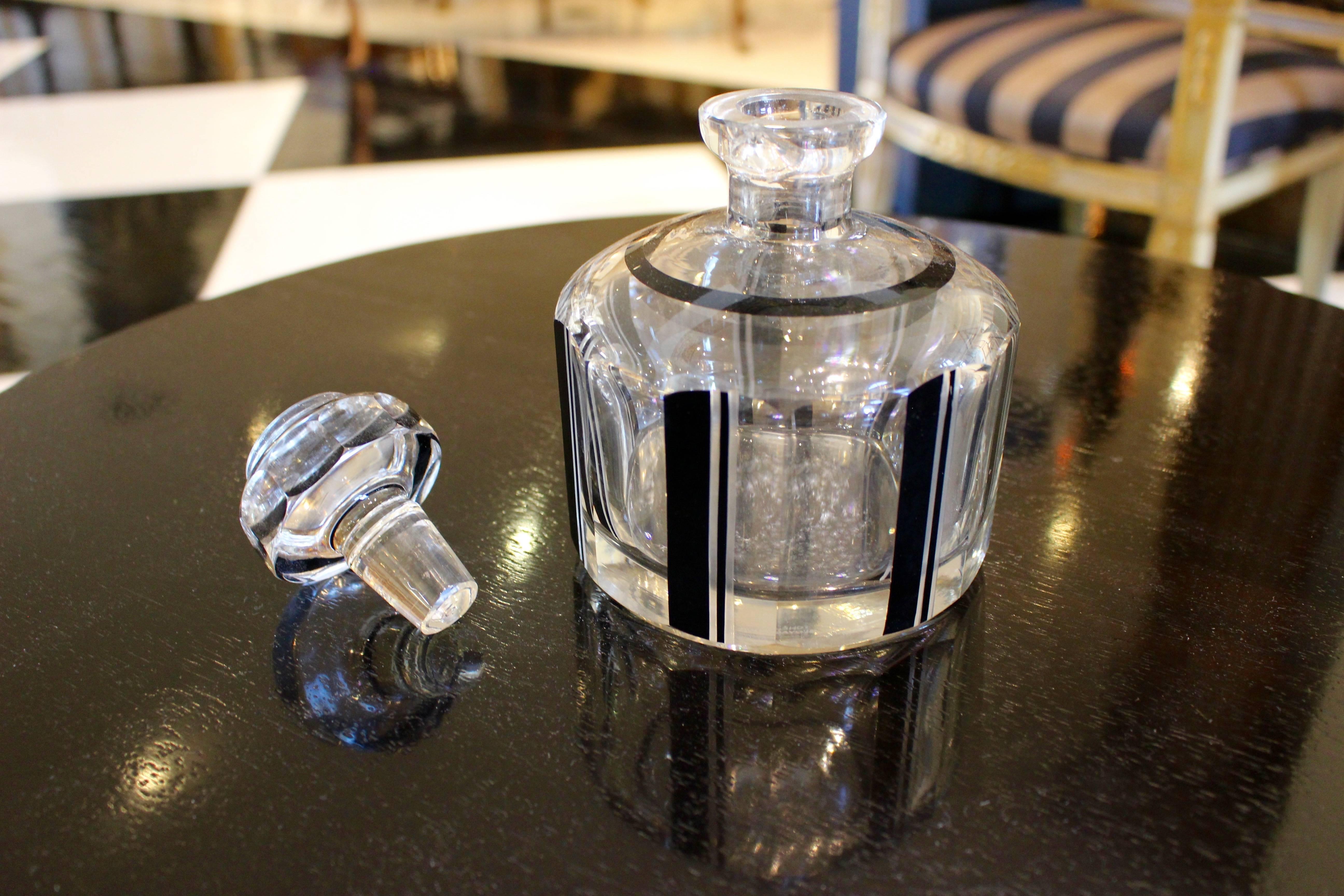 A rare surviving Art Deco round decanter with sleek black and silver accents which were made popular during the early 20th century.