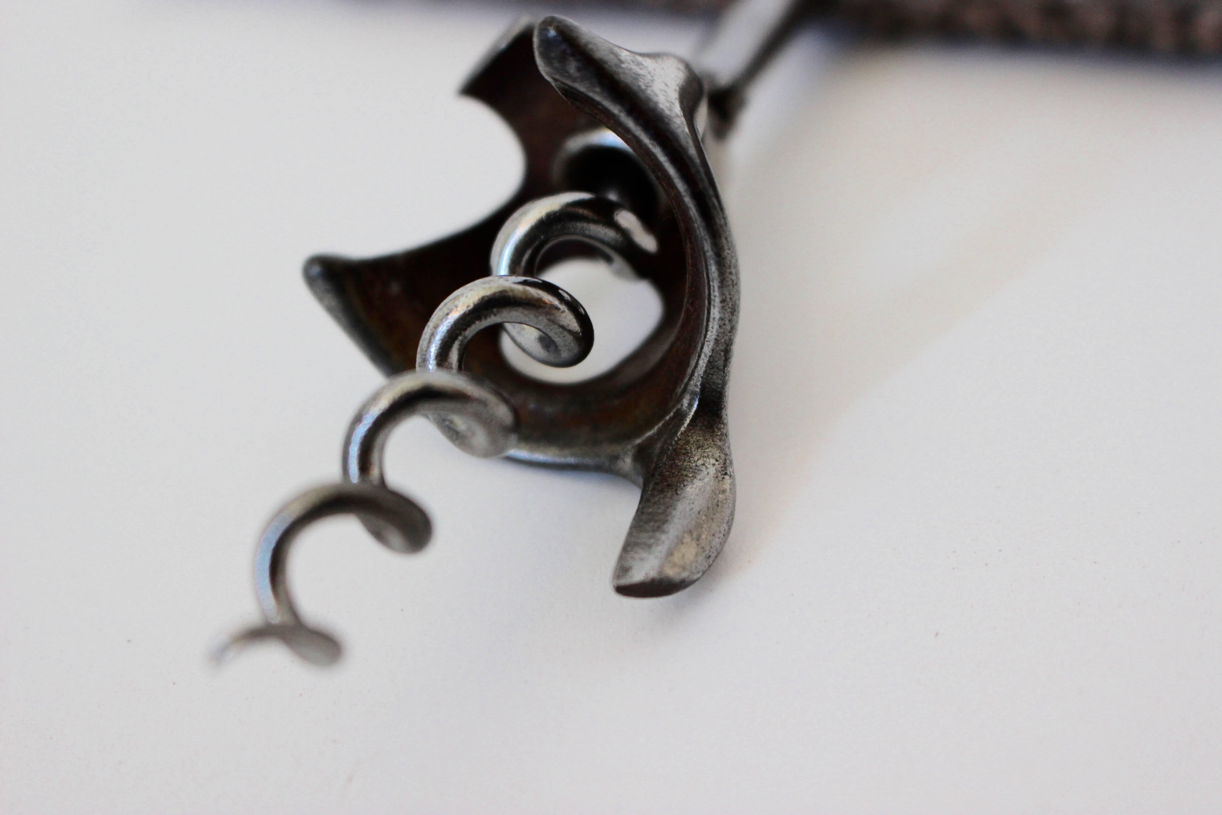 An elegant silver plated corkscrew, 20th century.