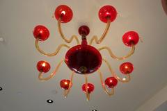 Vintage Italian 1970s Ruby Gold and Colorless Murano Glass Nine-Light Chandelier