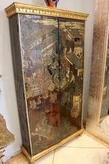 Pair of Chinese Carved Coromandel and Parcel-Gilt Cupboards