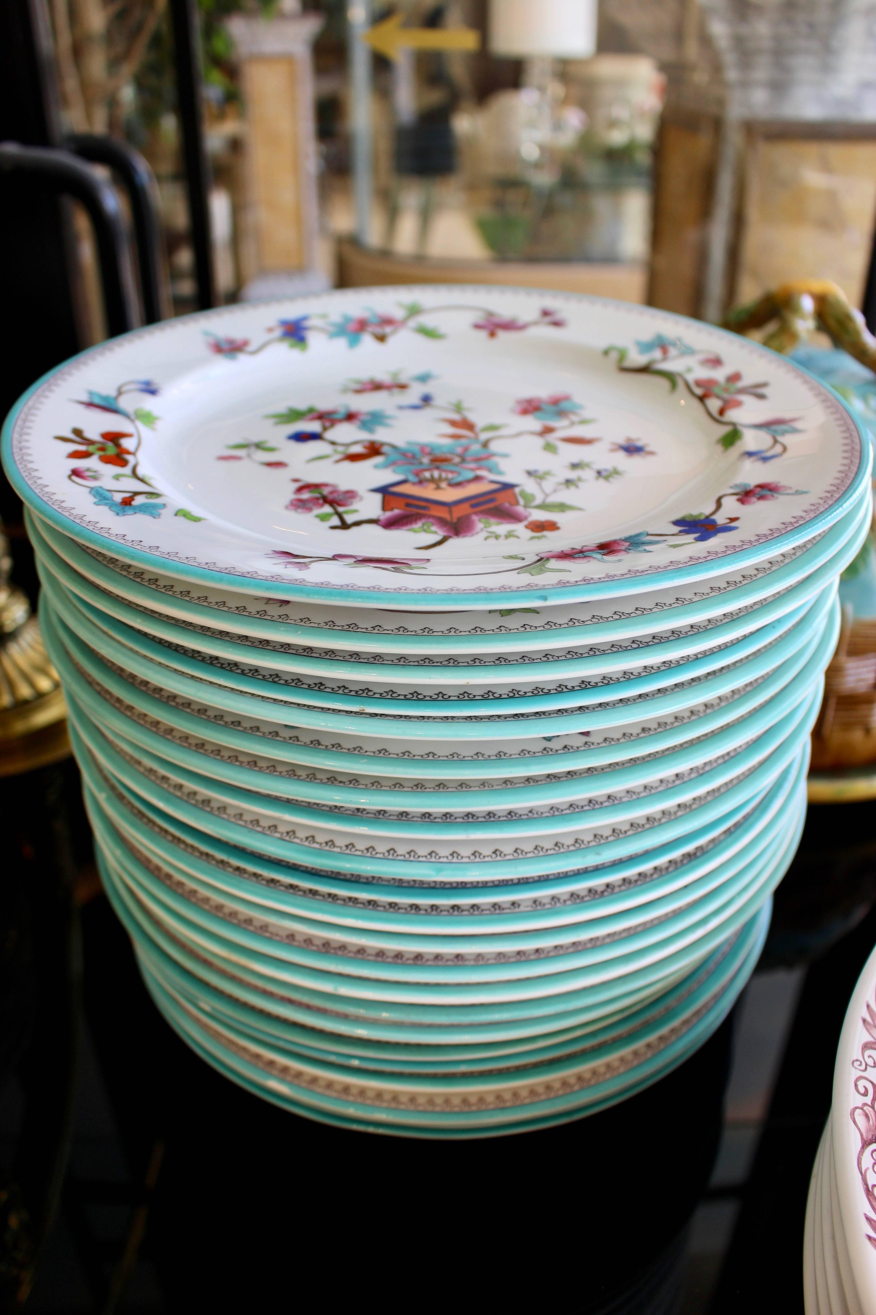 Set of 22 English porcelain hand-painted floral plates. Measuring 10